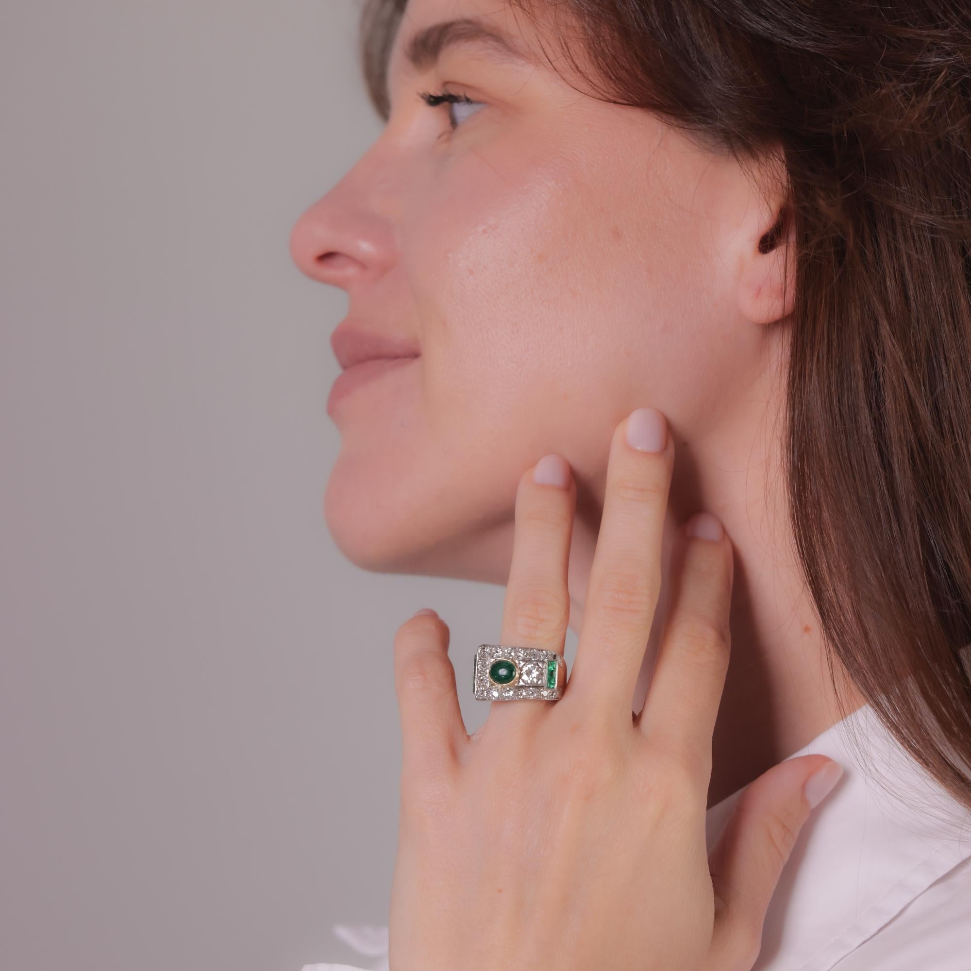 This Retro ring features a 0.75-carat cabochon emerald, a 0.75-carat Old European cut diamond, and emerald and diamond accents in 18k yellow and 14k white gold. Circa 1940s.

Center stone: Cabochon cut emerald
Weight: Approximately 0.75