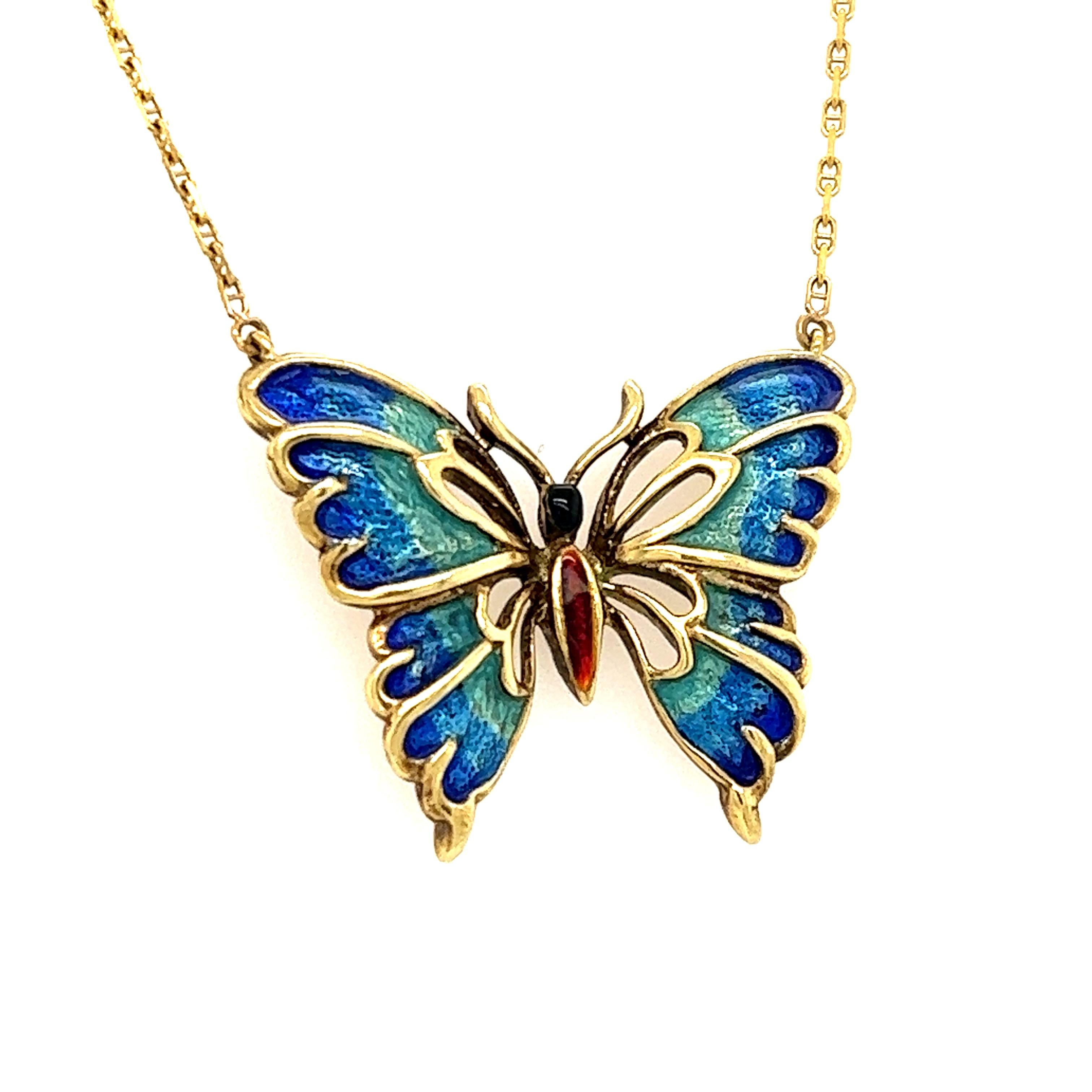 Beautiful everyday necklace crafted in 14k yellow gold. This beautiful necklace highlights one butterfly pendant which is enameled with vibrant shades of blue and green.  The colors pop off the design and contrast beautifully against the yellow