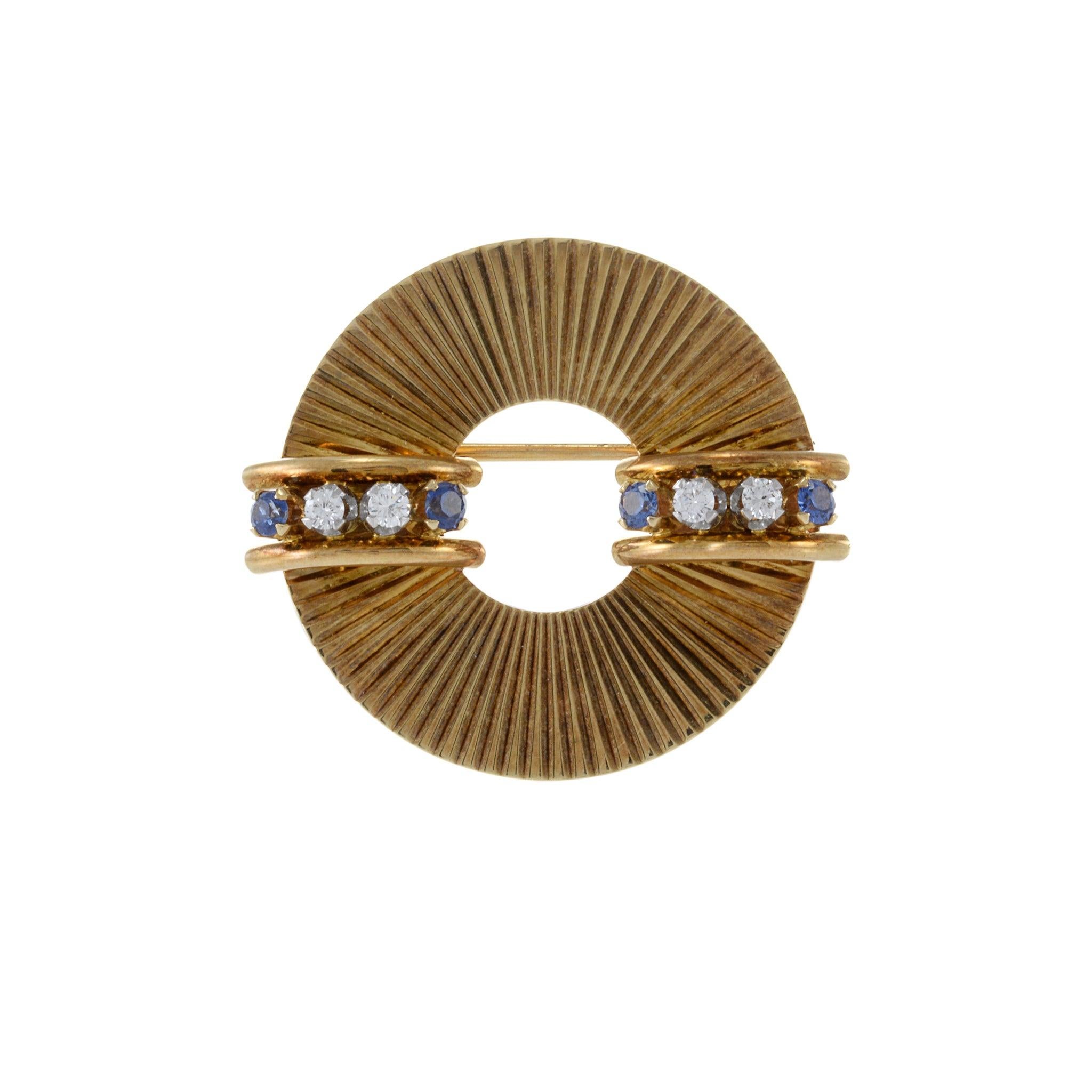 Expertly crafted with 14KT yellow gold and designed by the renowned Tiffany & Co, this brooch features sparkling 0.24CT-TW round cut diamonds and breathtaking 0.26CT-TW round cut blue sapphires. The combination of these high-quality materials and