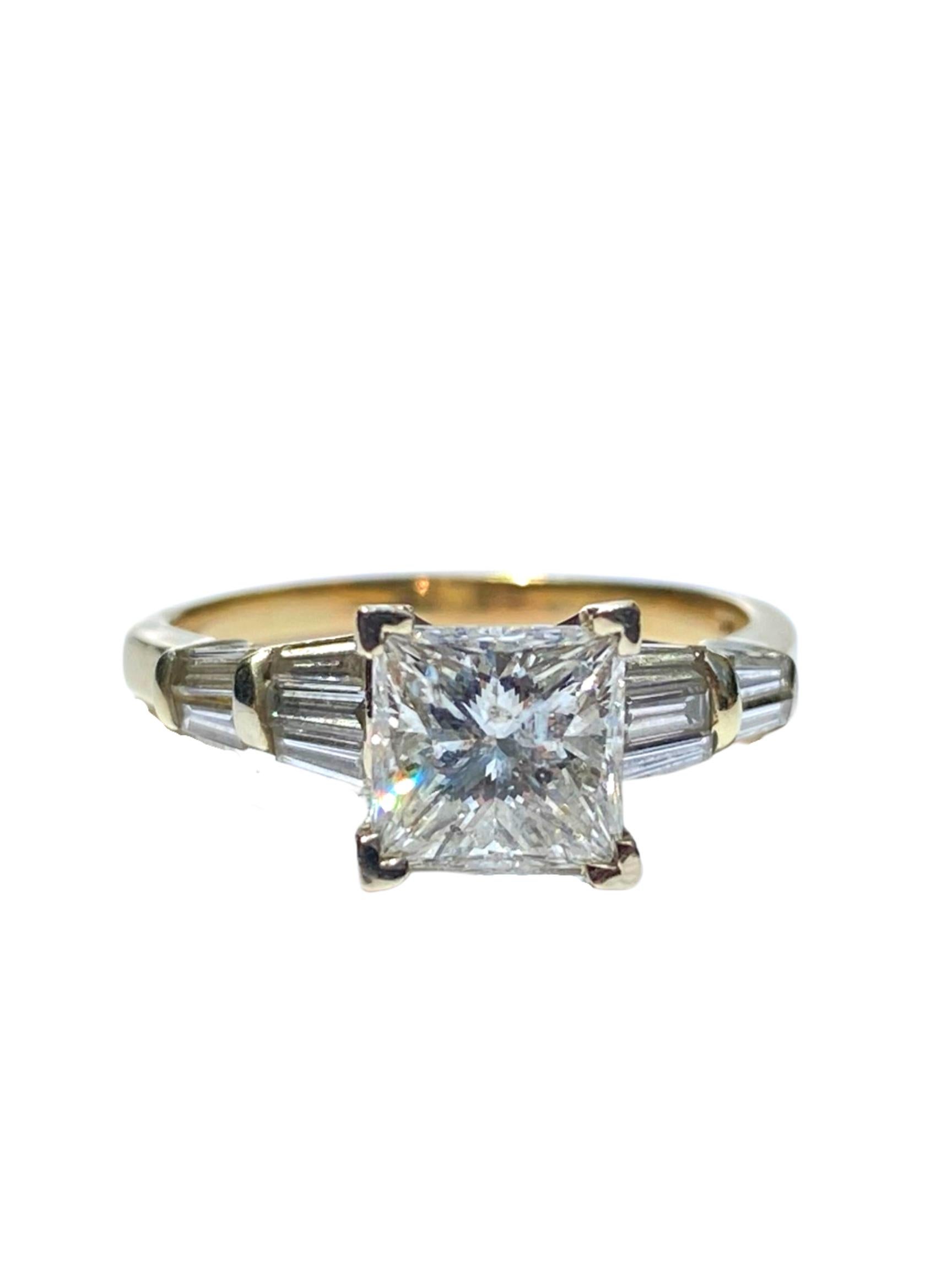 Lovely vintage diamond engagement ring centering a roughly ~1.50 Carat Princess-Cut Diamonds, shouldered by 10 Princess-Cut Diamonds totaling 0.60 carats, and set in 14K Yellow Gold. 

Details:
✔ Stone: Diamond
✔ Center-Stone Weight: ~1.50 Carats
✔