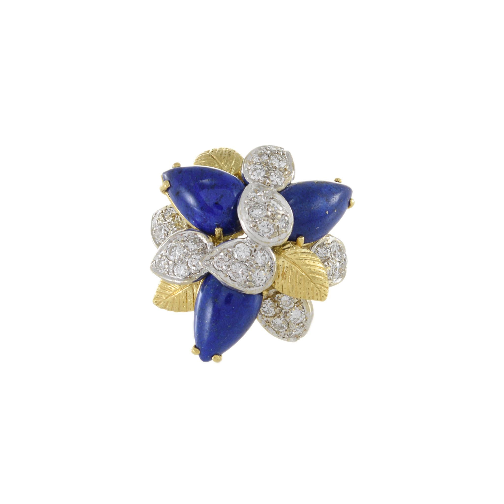 Introducing the Estate Retro Era 18KT Yellow Gold Lapis Lazuli and Diamond Flower Ring. This captivating ring showcases beautiful lapis lazuli gemstones surrounded by round cut diamonds weighing 1.25ct-tw G-VS. 

Crafted from 18KT yellow gold and