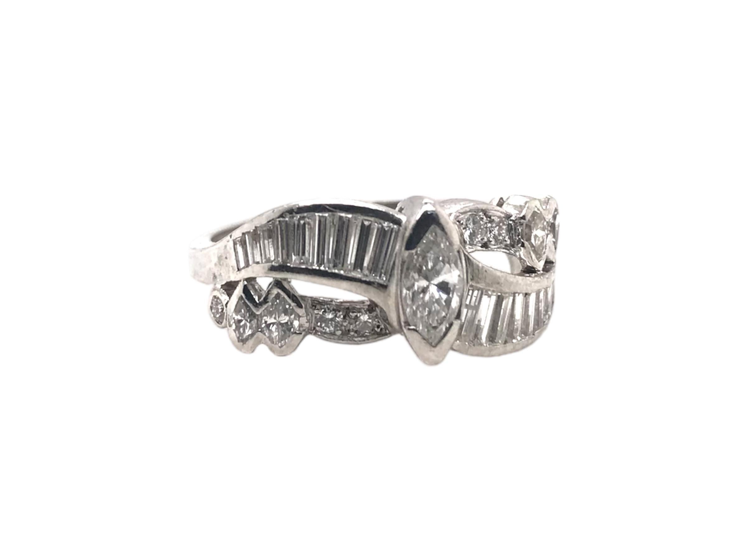 We love well done retro pieces such as this!
Exceptional use of different diamond cuts to make a stunning piece.

Ring Details
Era: Retro 1940 - 1960
Width: 9.0mm
Shank Width: 2.0mm
Weight: 6.5 Grams
Finger Size: 7 1/4 
Sizing Available Upon