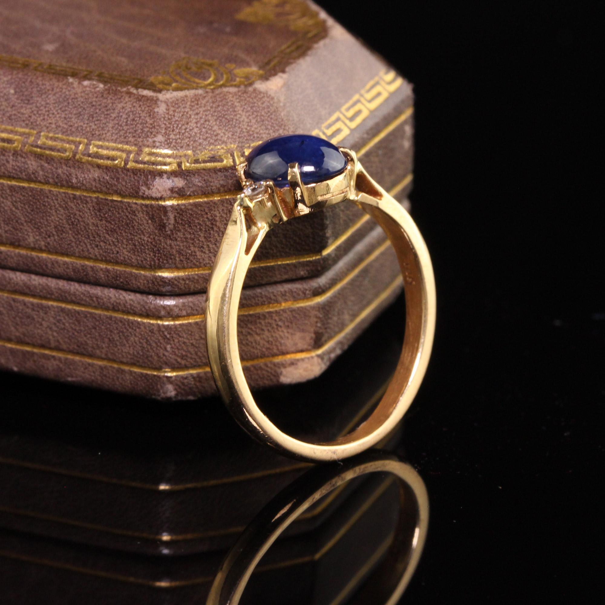 Stunning Retro Estate 18K Yellow Gold Cabochon Sapphire Diamond Ring. This beautiful ring features a gorgeous blue sapphire in the center with a diamond on each side.

Item #R0471

Metal: 18K Yellow Gold

Weight: 2.4 Grams

Total Diamond Weight: