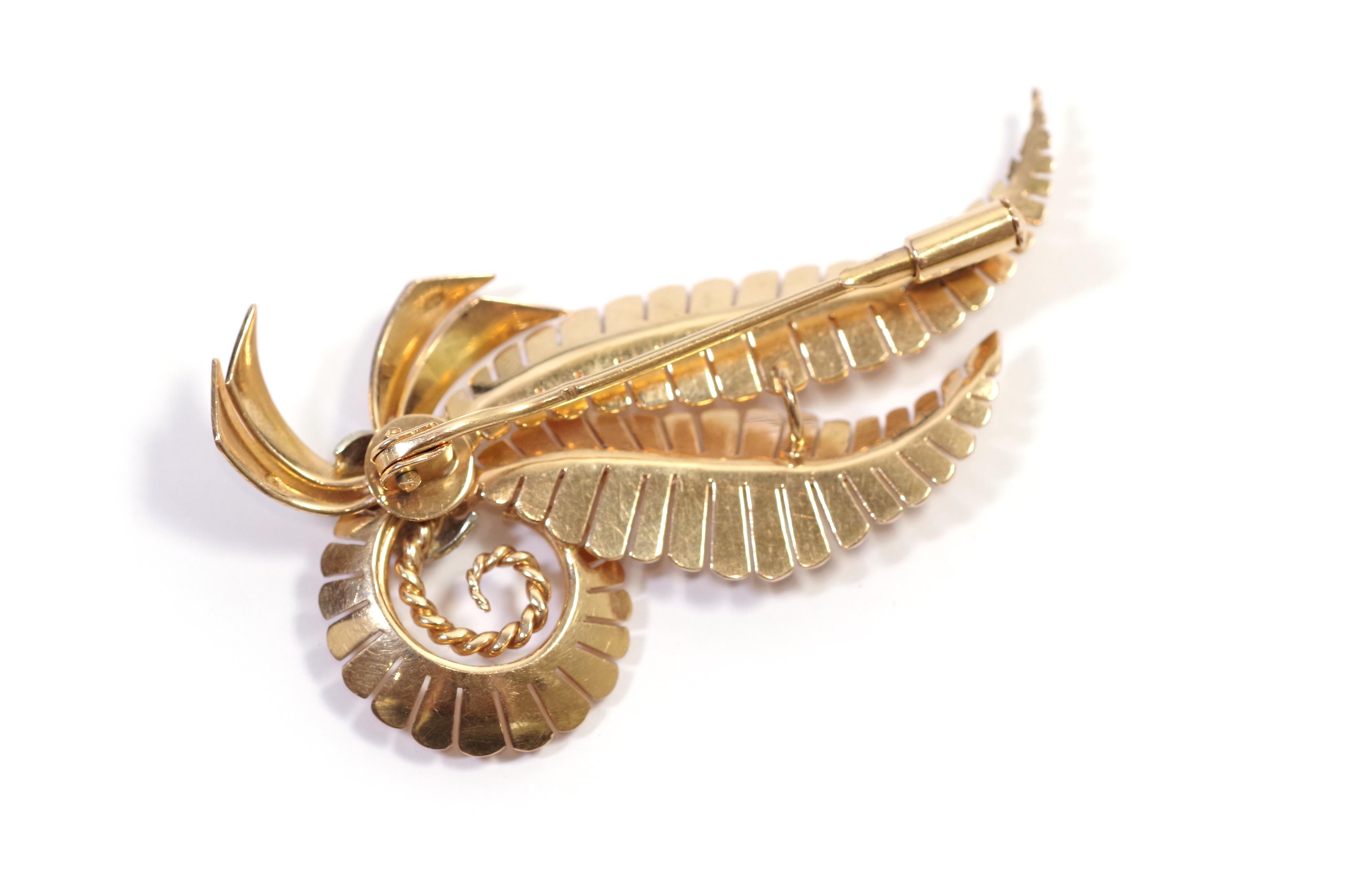 Retro Fern Diamond Brooch in 18-karat rose gold and platinum. This brooch from the Retro period takes the form of two fern leaves, connected by a platinum band set with three brilliant-cut diamonds. An antique brooch, circa 1945, from France.

It