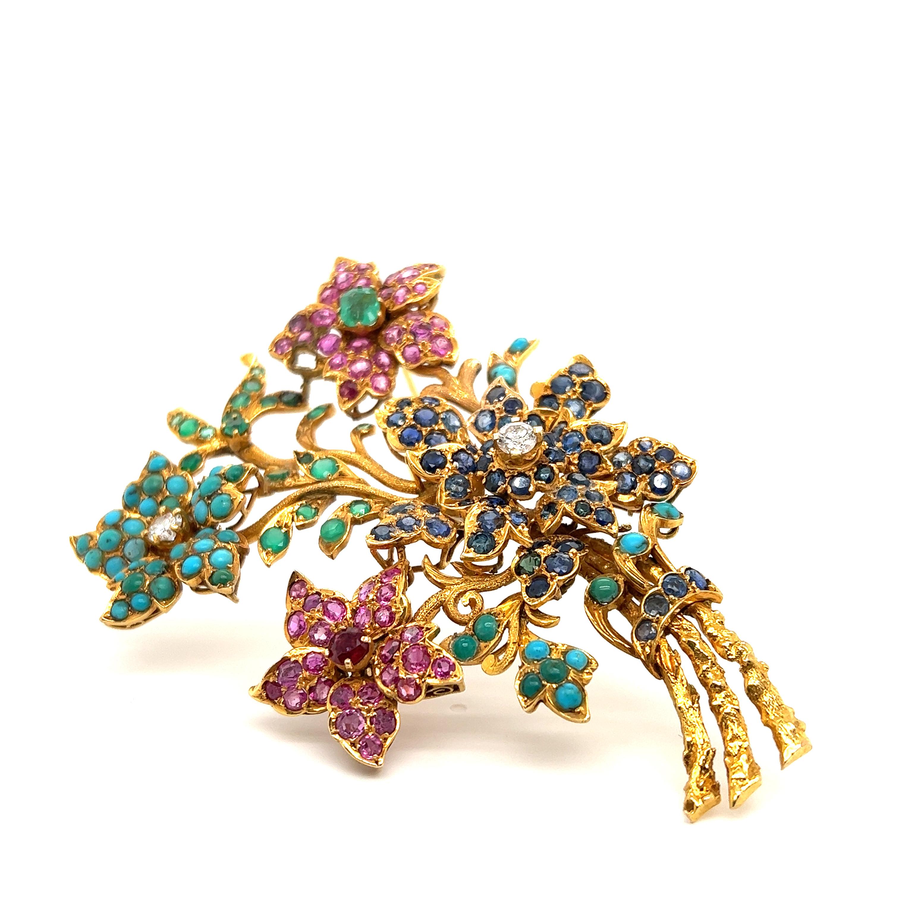 Fantastic design seen on this retro treasure. This brooch is crafted in the theme of a floral arrangment and is a large design! The brooch measures approximately 3.5