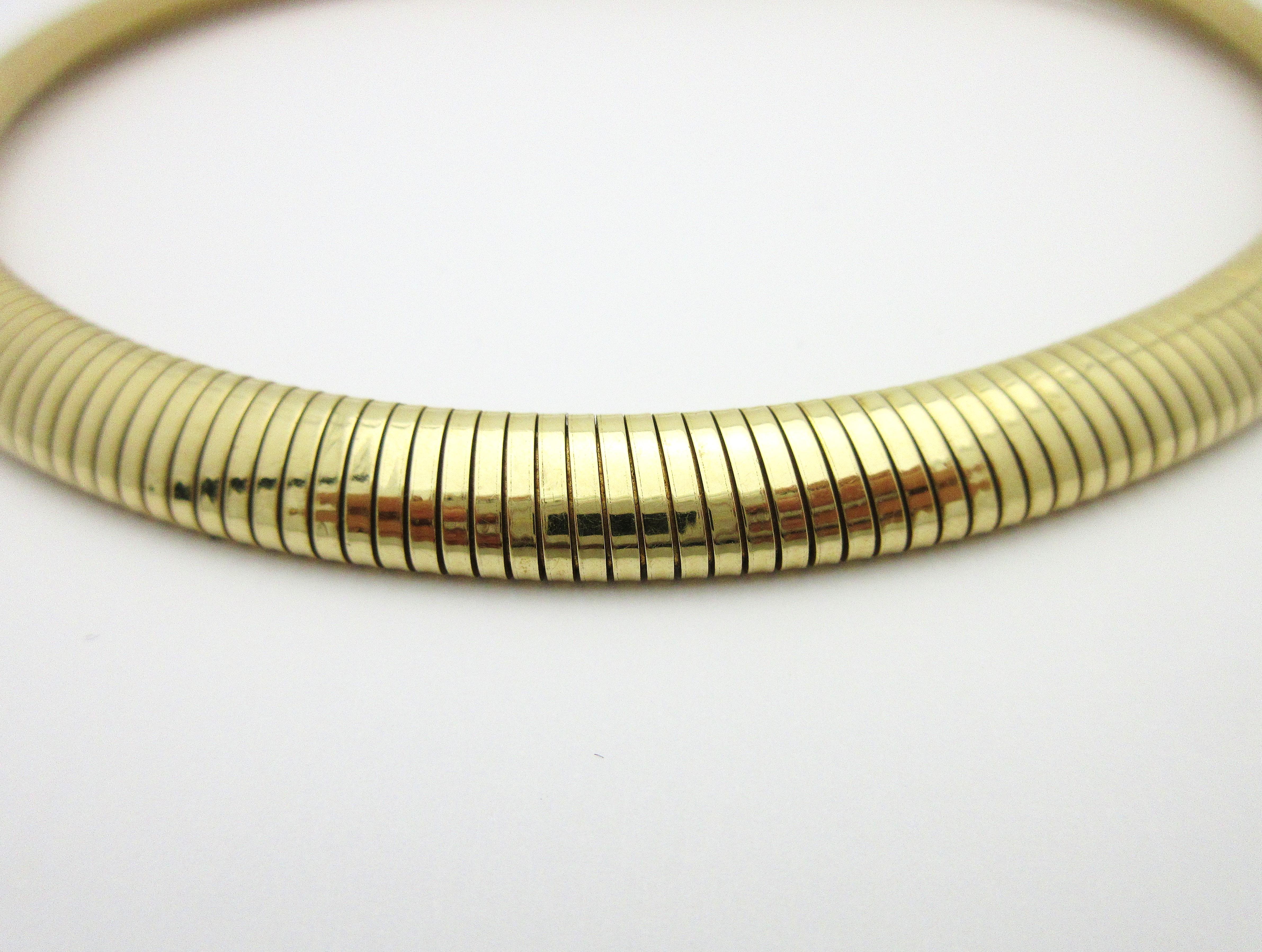 This fabulous retro necklace circa 1940s is a classic and rare piece by Forstner.  

The style of the coil is a callback to the types of materials and techniques available during World War II, and is reflected in the design of this 