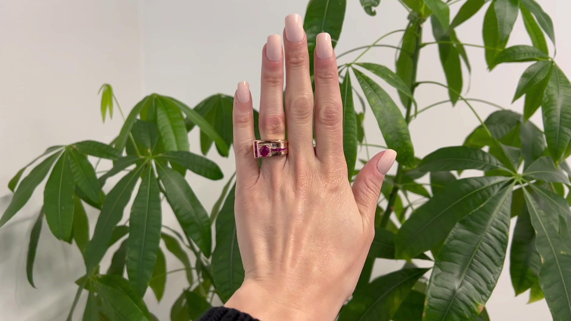 One Retro French 1.33 Carats Ruby 18 Karat Rose Gold Platinum Tank Ring. Featuring one round mixed cut ruby of 1.33 carats. Accented by three rectangular step cut rubies with a total weight of approximately 0.30 carat, and seven square step cut