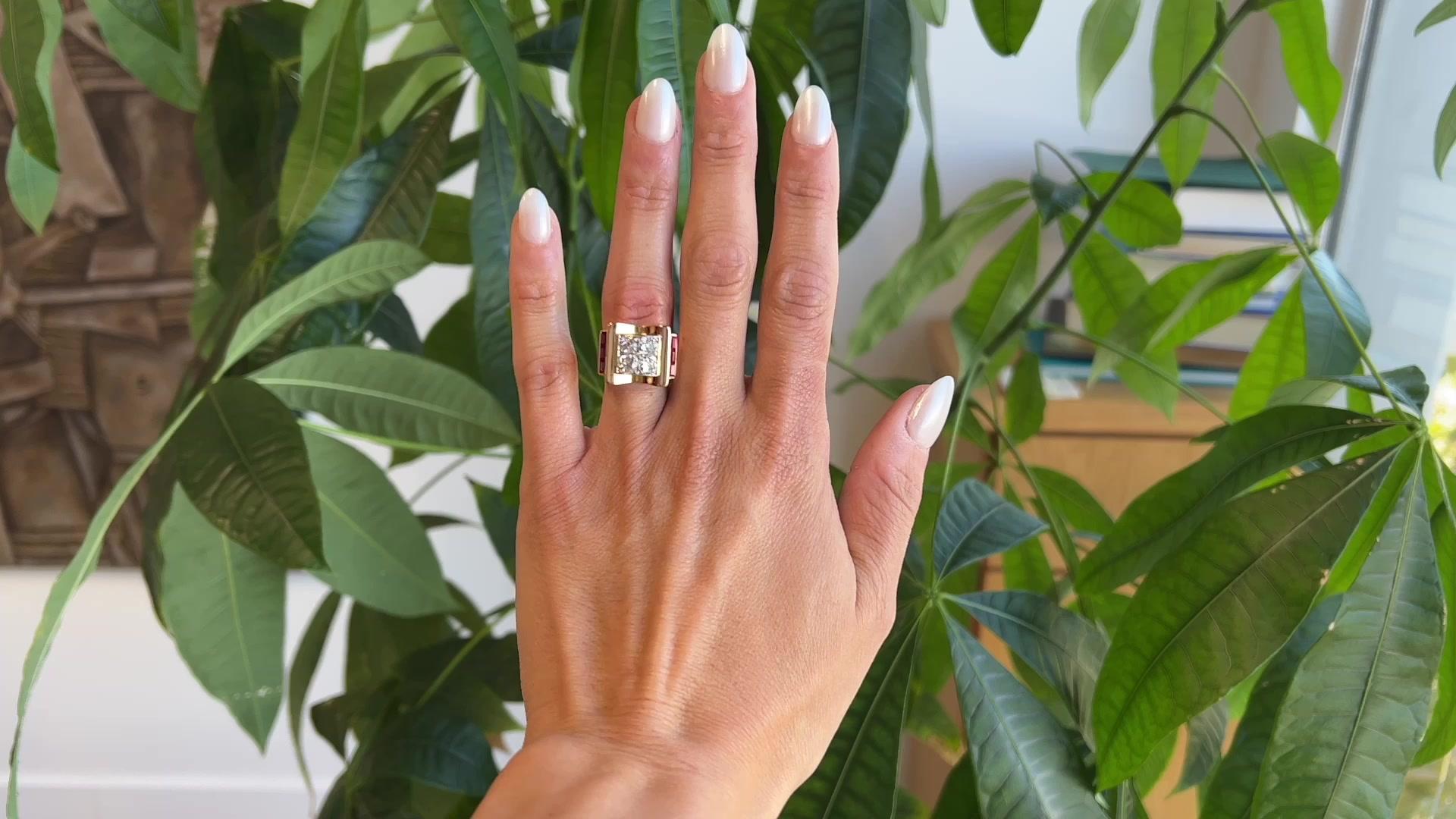 One Retro French 1.70 Carats Old European Cut Diamonds Ruby 18 Karat Gold Tank Ring. Featuring four old European cut diamonds with a total weight of approximately 1.70 carats, graded near-colorless, SI clarity. Accented by six rectangular step cut