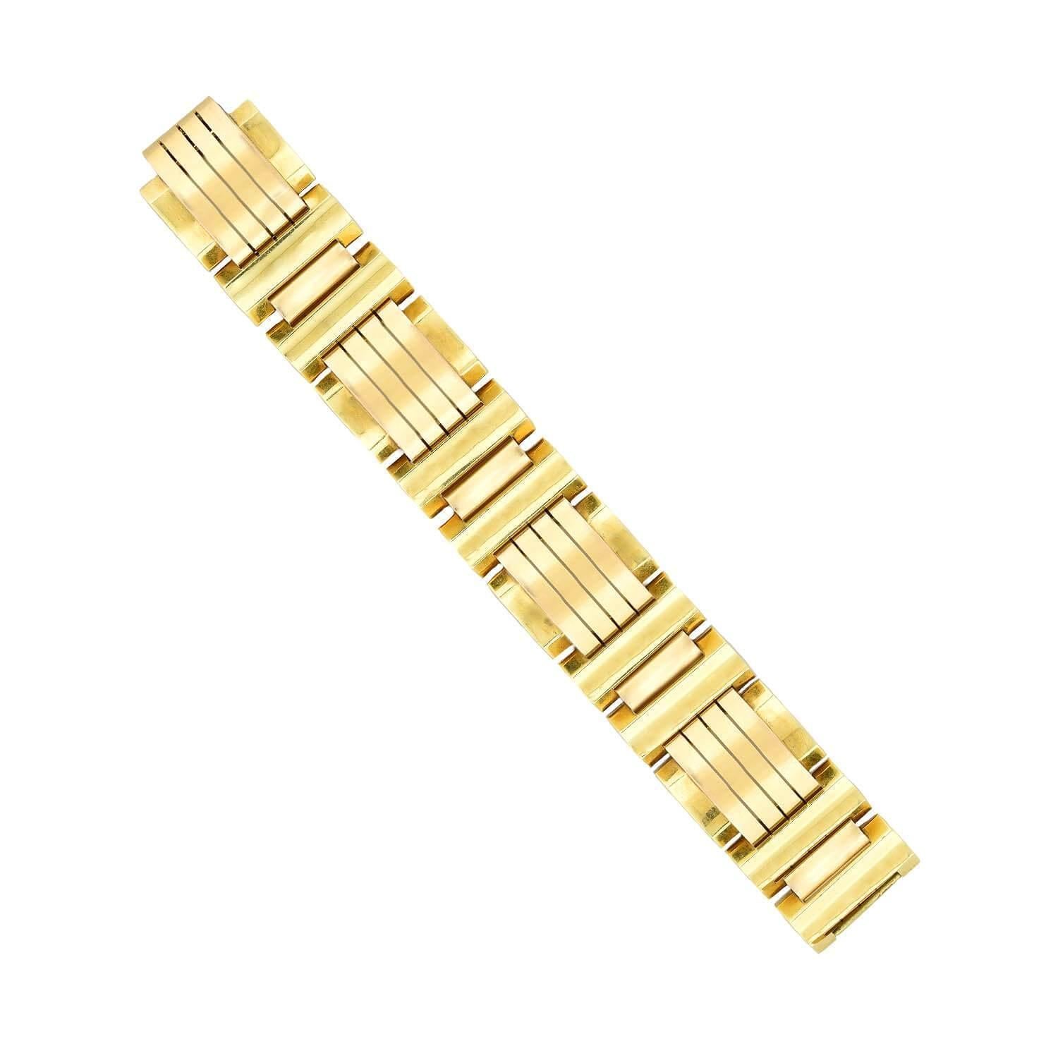 A fabulous bracelet from the Retro (ca1940s) era! Crafted in 18kt gold, this bracelet is comprised of twelve yellow gold links connected by rosy yellow gold bars. The intriguing geometric bar pattern has a wonderful mixed metal appeal and looks