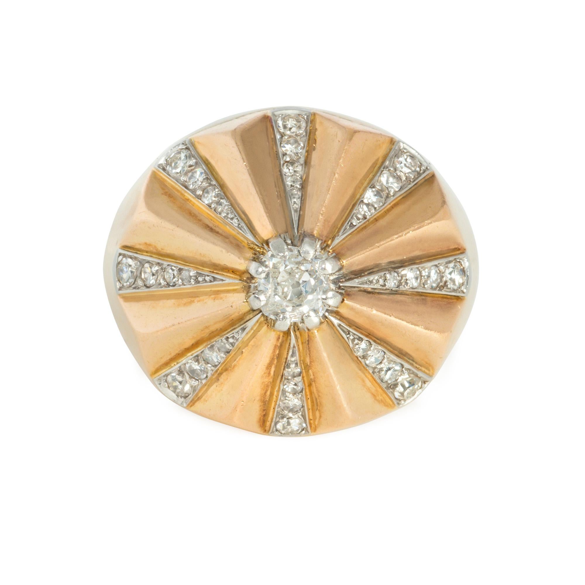 A Retro rose gold ring designed as a segmented cone with radiating diamond sections and terminating in an old-mine diamond, in 18k and platinum. Rousseau & Boulogne, France.  Atw old mine cut center 0.25 ct., atw single cuts 1.11 ct.