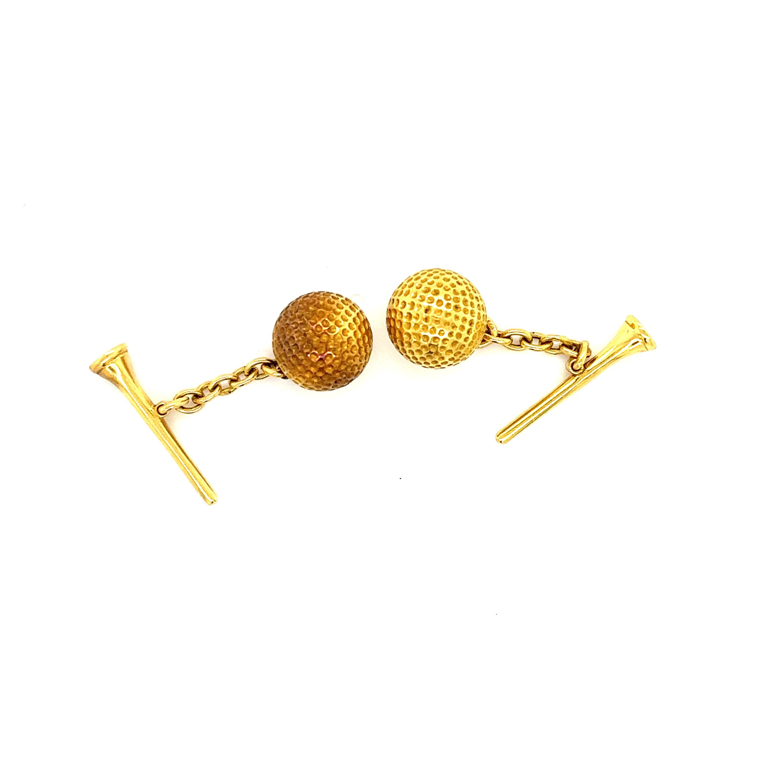 Fantastic display of craftsmanship shown on these hand crafted 18k yellow gold French retro cufflinks. The pair shows a golf theme as a finely detailed golf ball is linked to a tee. The pair are in excellent pre owned condition, they seem to rarely
