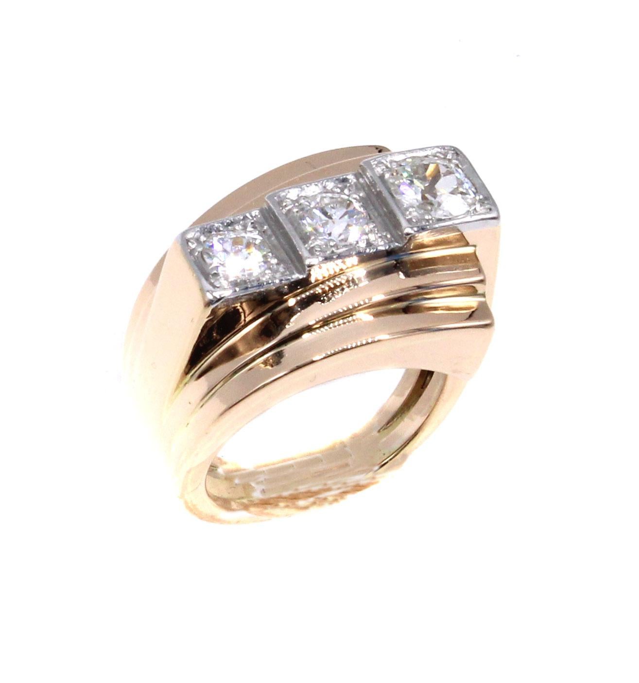 Masterfully hand-crafted in 18 karat rose-gold and platinum this French Retro ring from ca 1940 displays an true avant-garde look. The asymmetrical construction of curved bands of gold at different levels on either side of the ring, with 3 Old