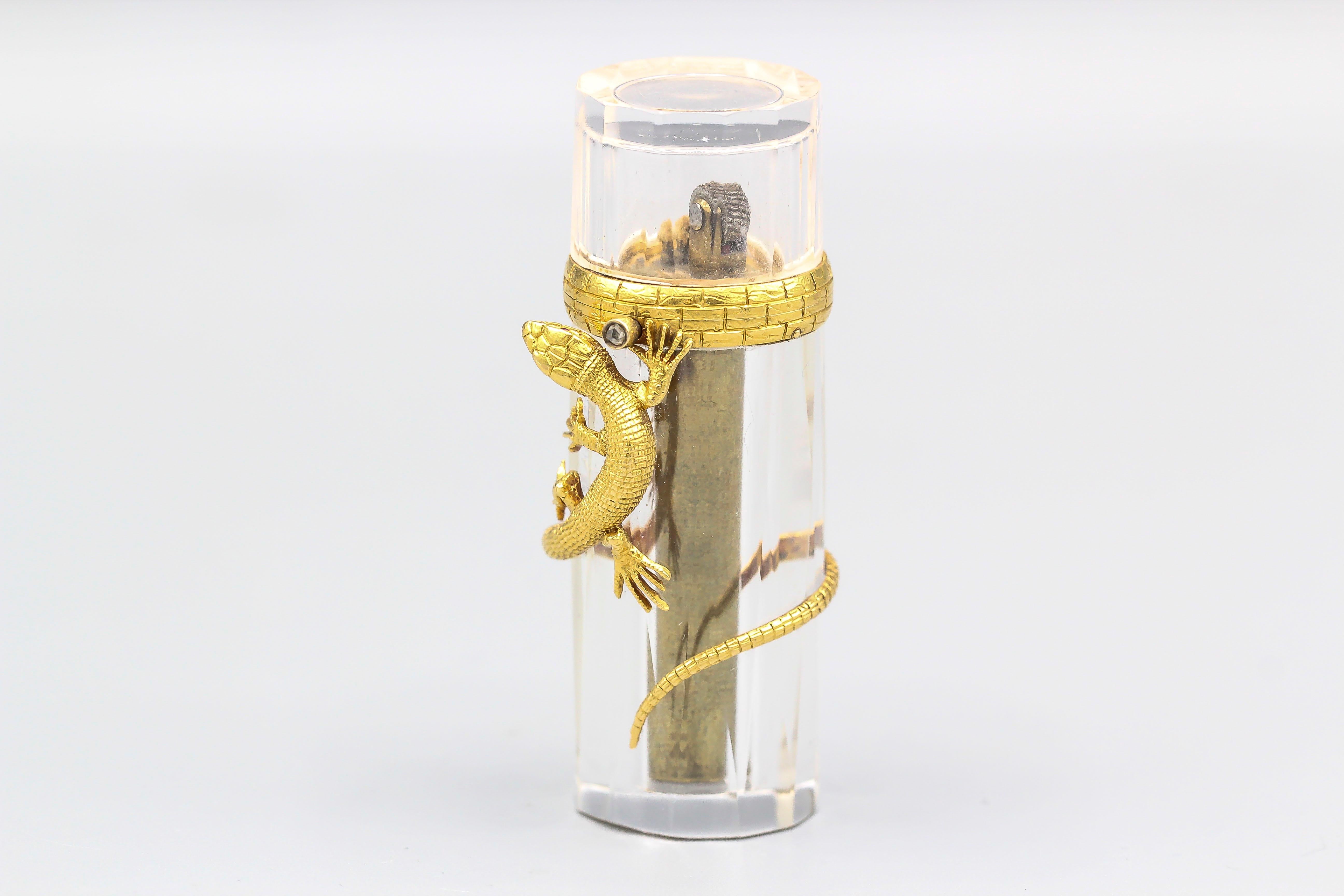 Very fine lighter of French origin, circa 1930-40s. It features a rock crystal body with a diamond on its clasp, and a posing gold lizard with ruby cabochon eyes.  Has flint and strikes well, needs lighter fluid.  Very rare and collectible. 