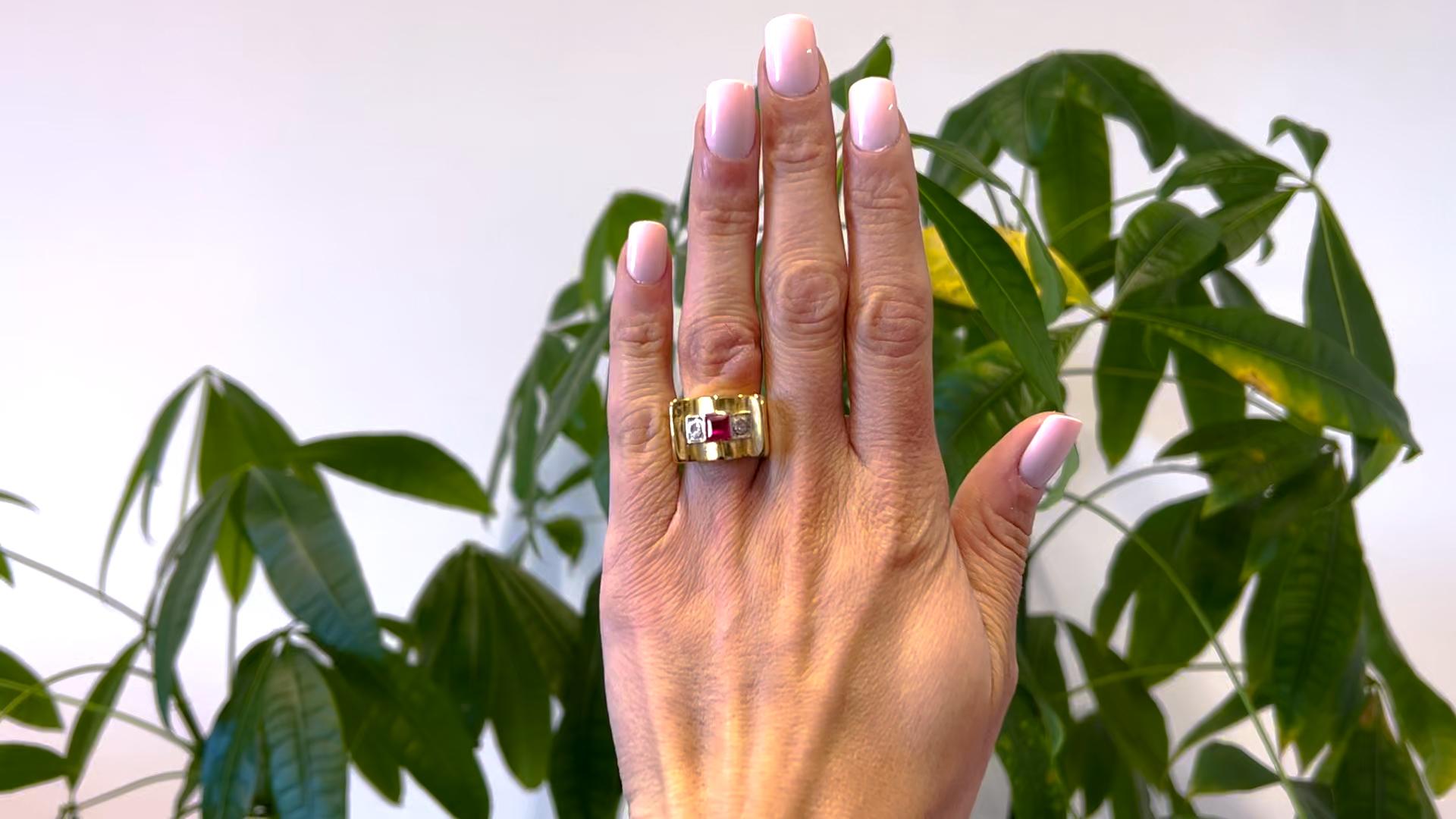 One Retro French Synthetic Ruby and Diamond 18k Yellow Gold Platinum Tank Ring. Featuring one square step cut synthetic ruby weighing approximately 0.70 carat. Accented by two rose cut diamonds with a total weight of approximately 0.10 carat, graded