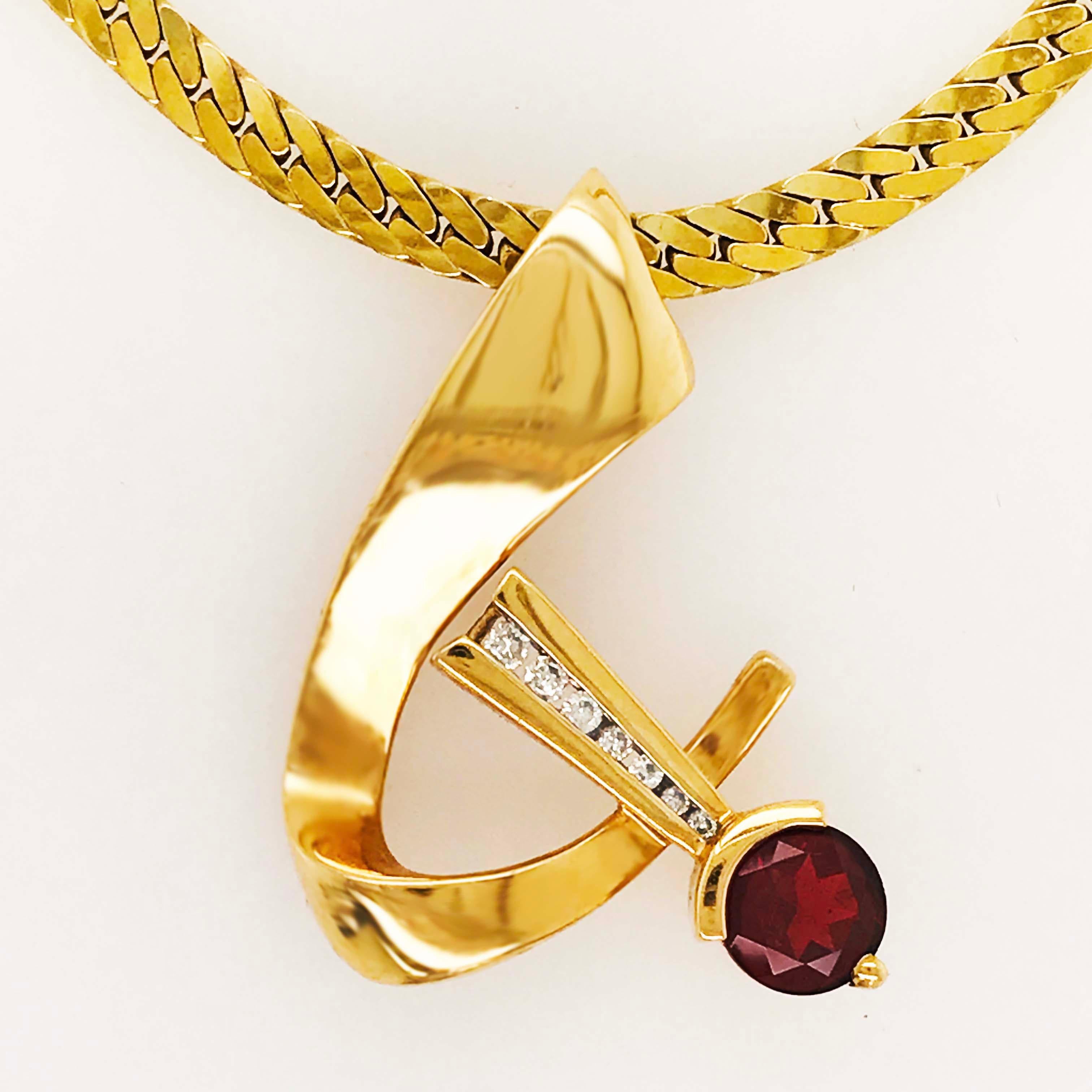 This gorgeous diamond and garnet pendant is a retro, custom design with a high polished finish. The slide pendant is on a 14 karat yellow gold, Miami Cuban, flat cable link chain that is 16 inches and 3.6 millimeters wide. The 14 karat yellow gold