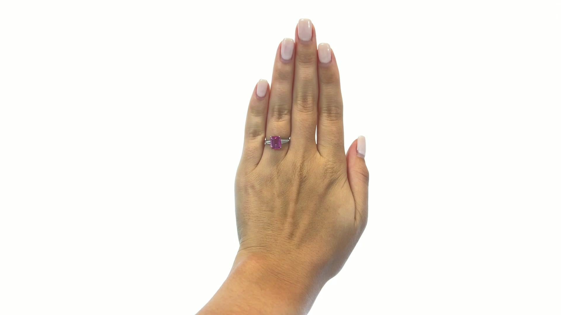 Retro GIA Sapphire Diamond Platinum Ring. Featuring GIA octagon 2.11 carat Purple-Pink sapphire (#5212010858). Accented by 2 tapered baguettes approximately 0.20 carat total, G color, VS clarity. Signed Gleim. Circa 1950s. Size 3 3/4 and may be