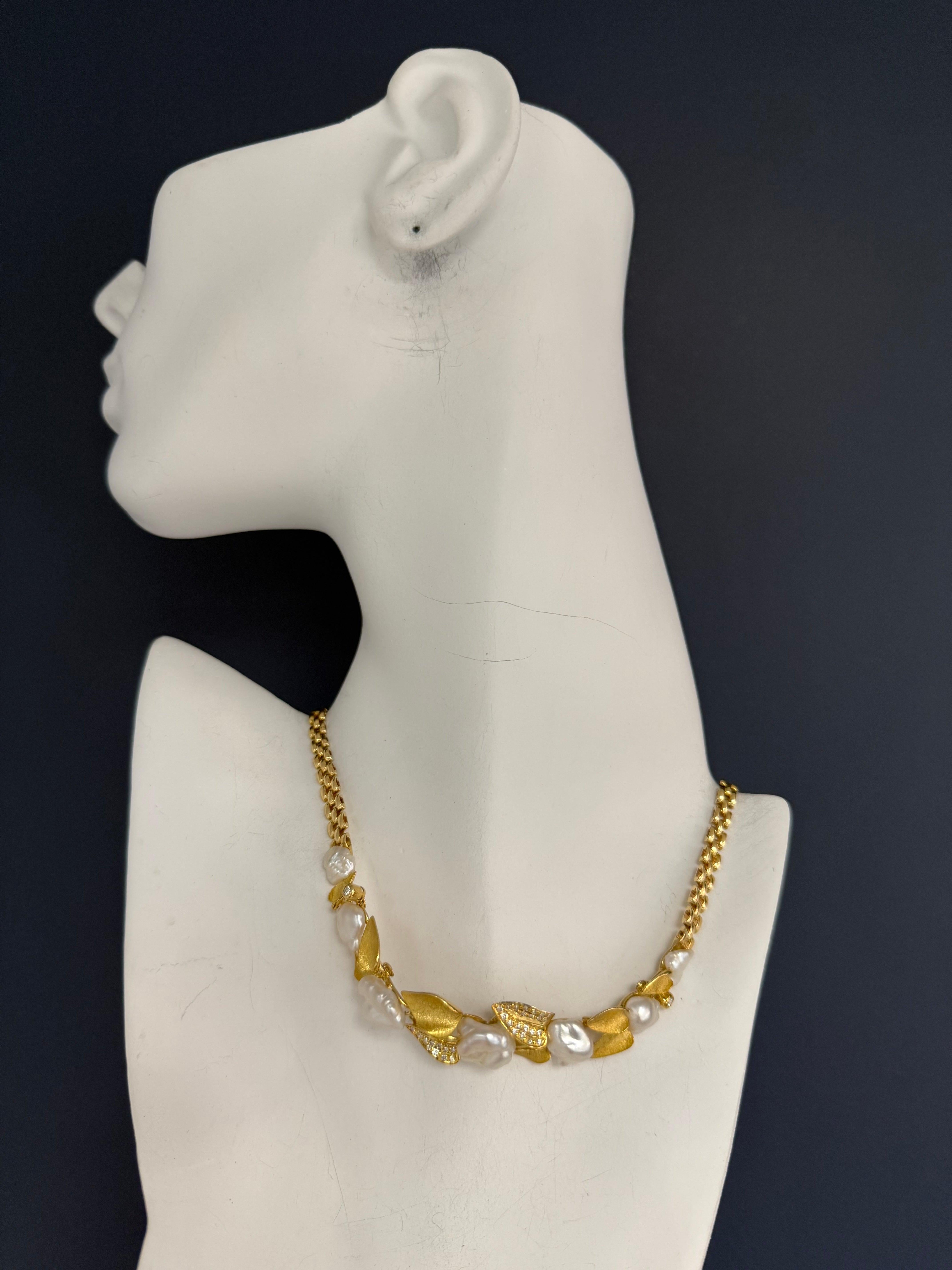 This rare handmade choker features an elegant leaf motif in 18K yellow gold, stamped 750 and weighing 32.1 grams. Measuring 14 1/2 inches in length, its set with 44 colorless round brilliant natural diamonds totaling approximately 0.75 carats.