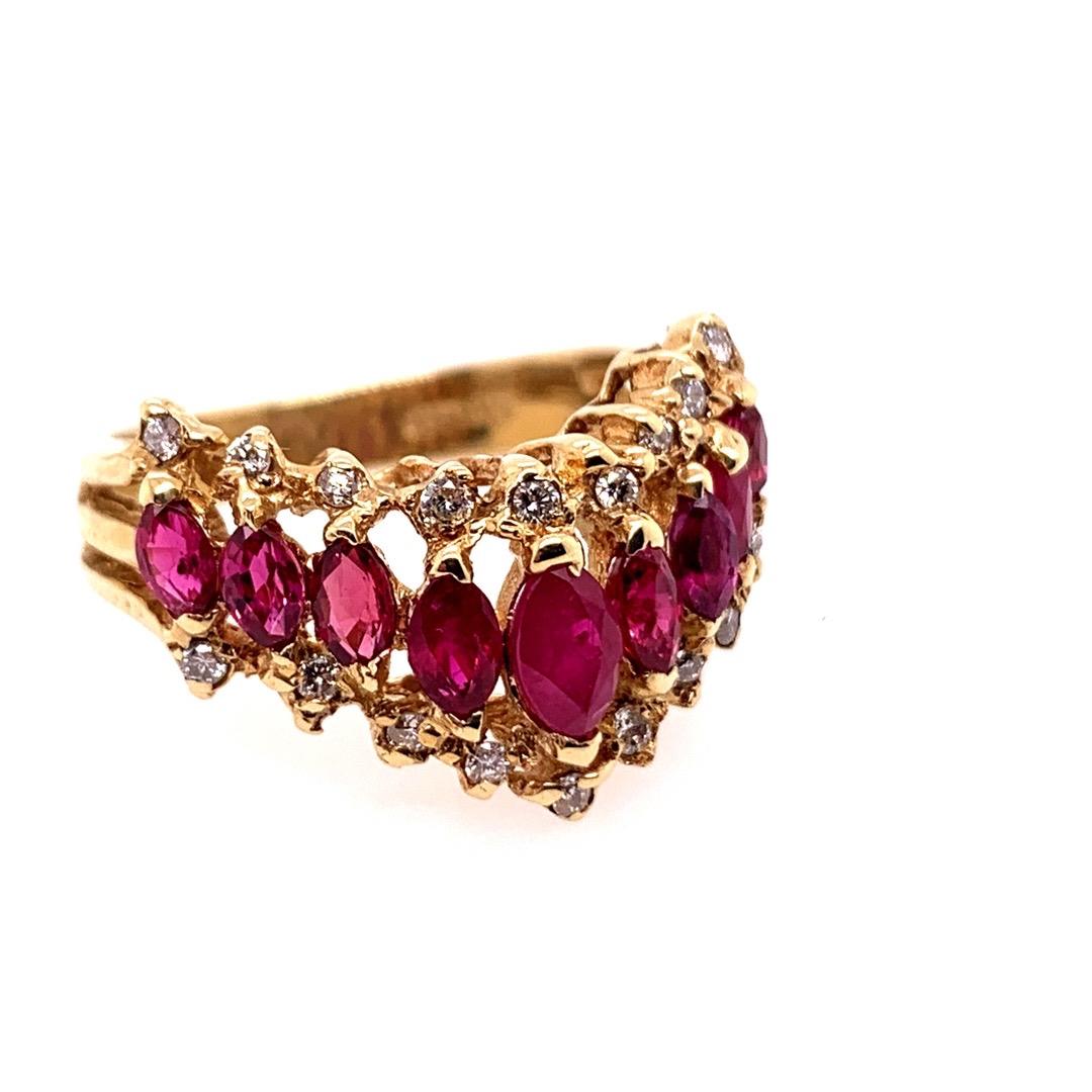 Retro 14k Yellow Gold 2 Carat Natural Marquise Ruby & Diamond Cocktail Ring, Circa 1960. 

Included are 19 Natural Round Brilliant diamonds (approximately .15 carats) AND 9 Marquise shaped natural rubies graduating measurements of 5.5x3mm down to