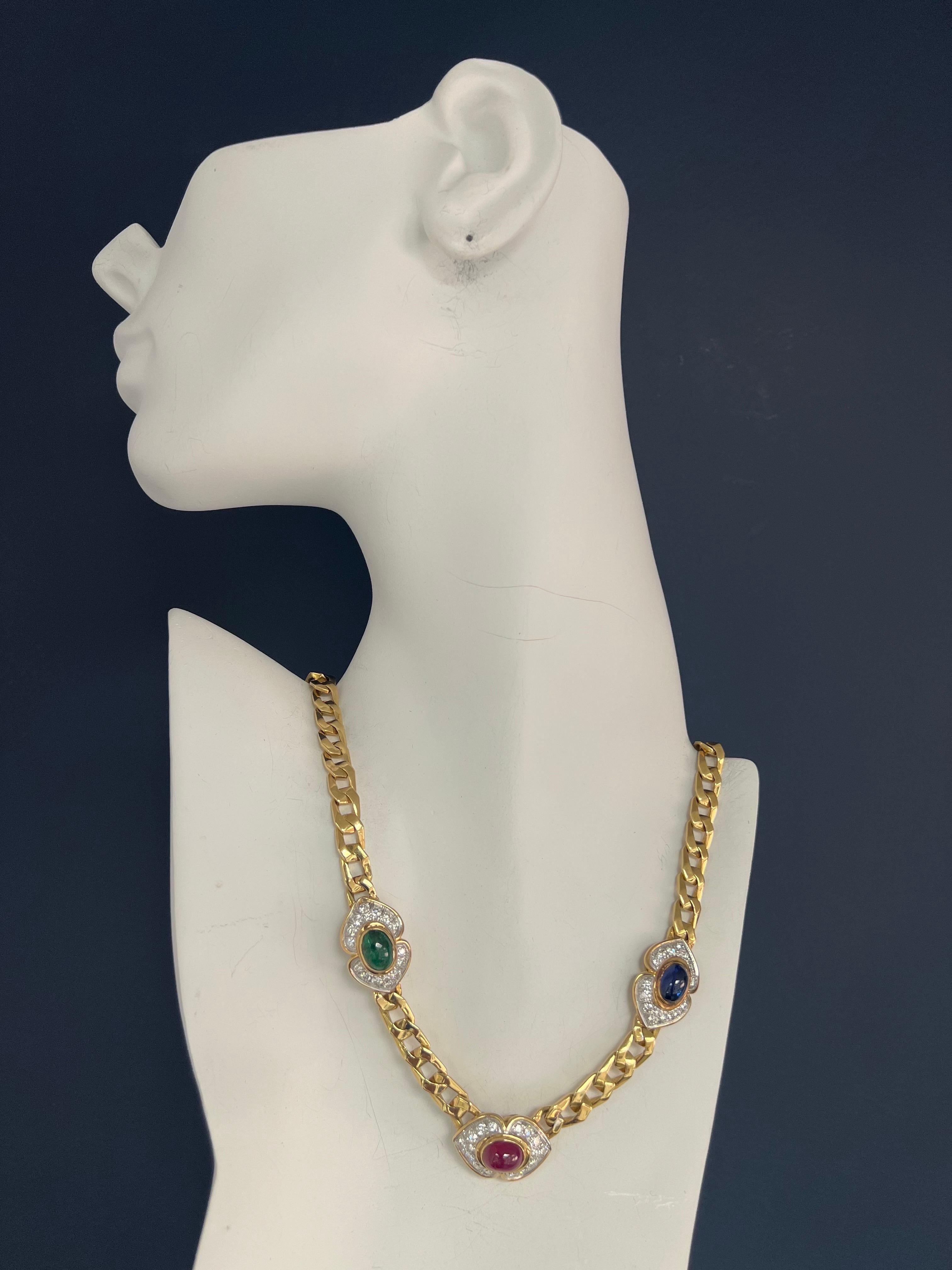 A Magnificent 14.50 Carat Natural Colorless Round Brilliant Diamond, Ruby, Sapphire and Emerald Cabochon necklace set in 18k Yellow Gold. 

The piece is set with 48 colorless Round Brilliant diamonds weighing a total of 4.20 Carats, VS in clarity.