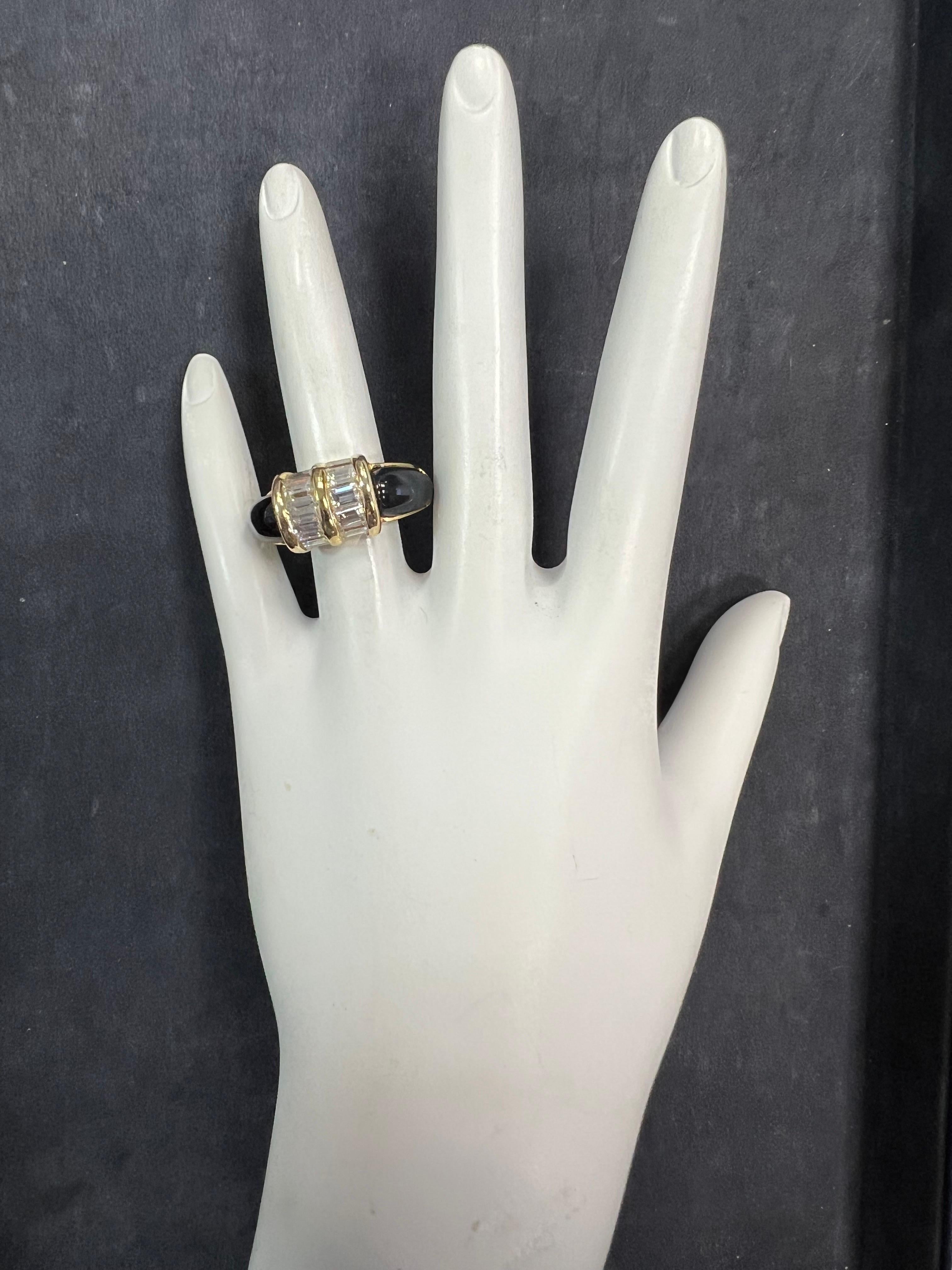 A stunning retro 18k yellow gold 2.50 carat natural baguette diamond and onyx cocktail ring, circa 1960.

The ring is set with ten natural baguette diamonds (approximately G-H in color, VS in clarity).

It is a size 7.25 and weighs 14 grams total.
