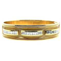 Retro Gold 2.50 Carat Natural Colorless Baguette Diamond Bangle Circa 1970