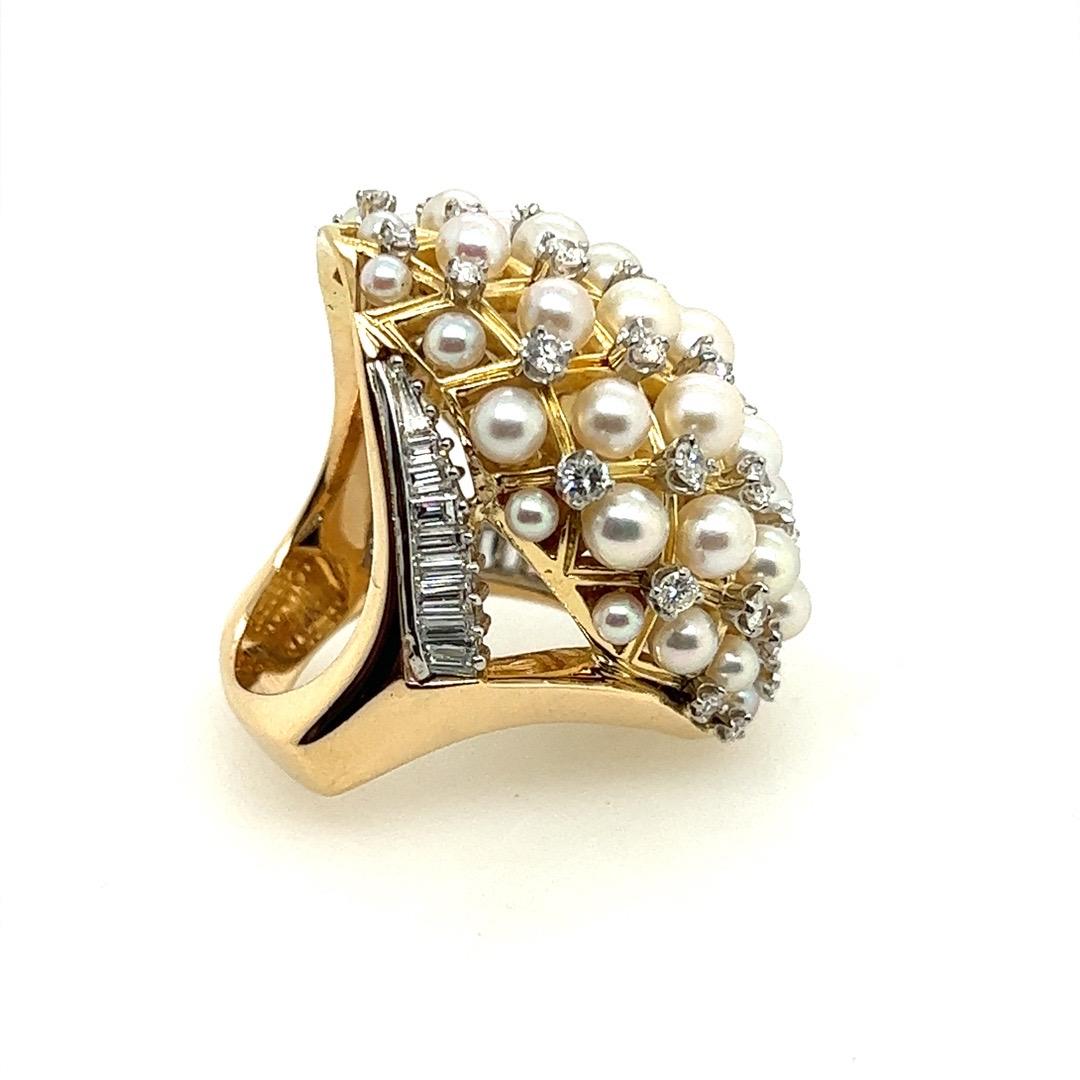 A Magnificent 14k gold cocktail ring set with 18 colorless VS natural baguette diamonds weighing approximately 1 carat and 38 natural round brilliant colorless VS diamonds weighing approximately 1.52 carats.  

Total weight for the diamonds are
