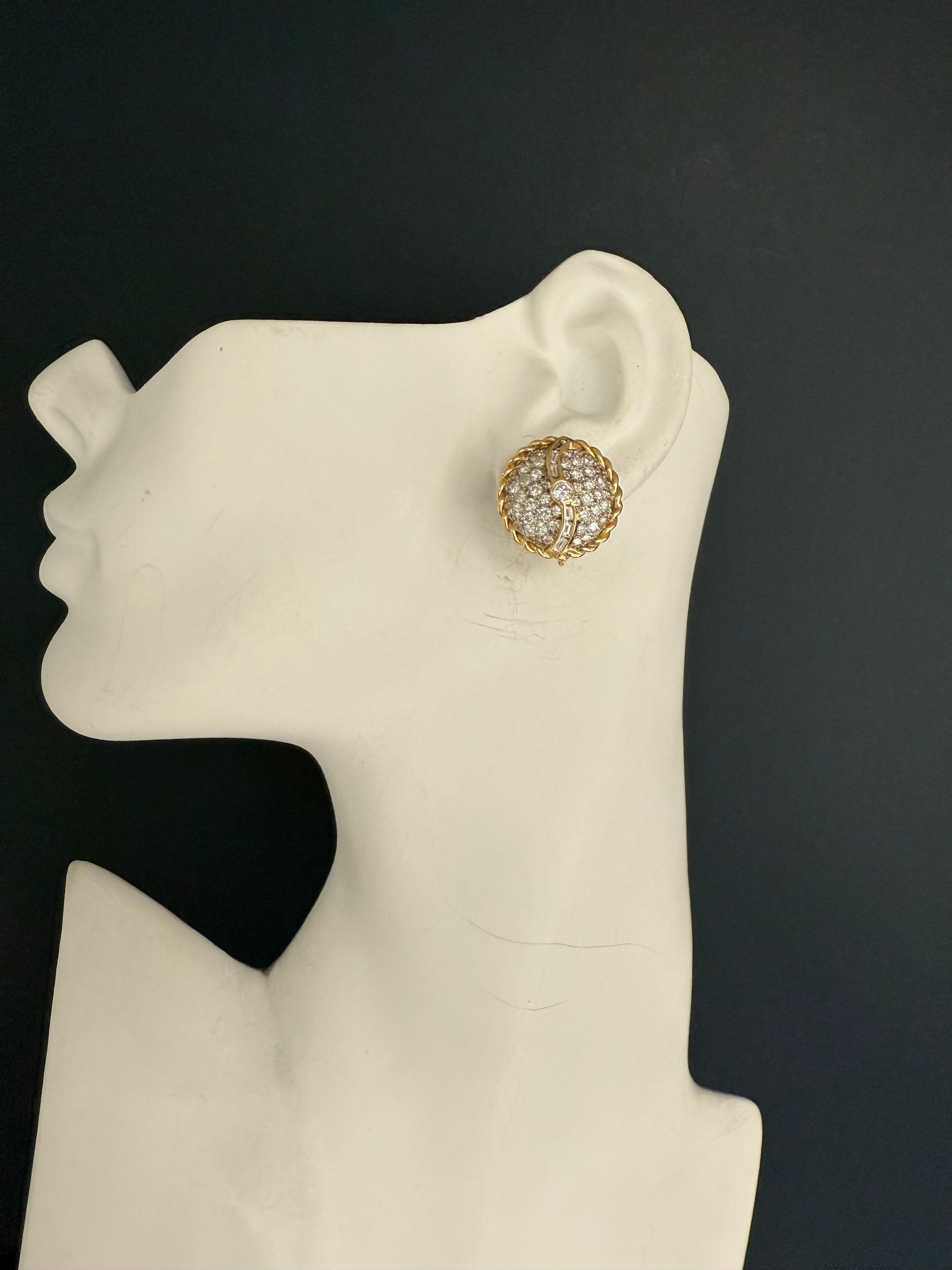 A striking retro pair of earrings crafted in two-tone 14K white and yellow gold, set with approximately 3.00 carats of natural diamonds. The design features 90 round and 12 baguette colorless diamonds, offering a bright and timeless appeal. The