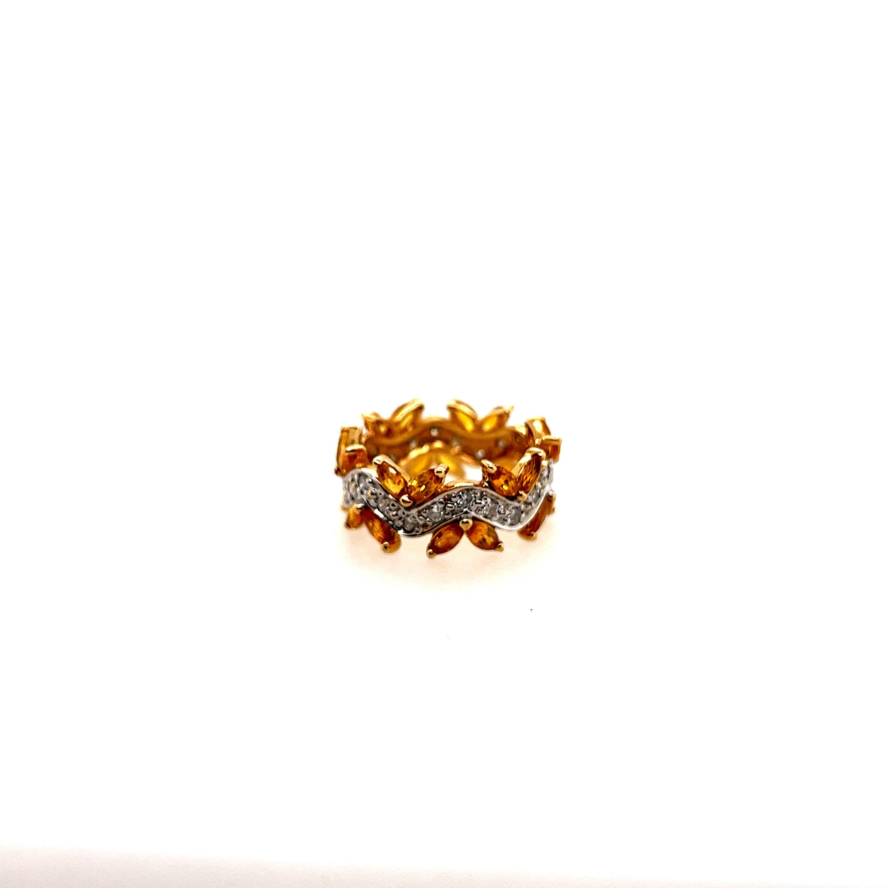 Retro 14k Yellow Gold 3 Carat Total Weight Natural Yellow Sapphire & Diamond Cocktail Ring, Circa 1970.

The ring is set with 24 marquise shaped natural yellow sapphires weighing 2.50 carats as well as 24 natural full cut round diamonds,