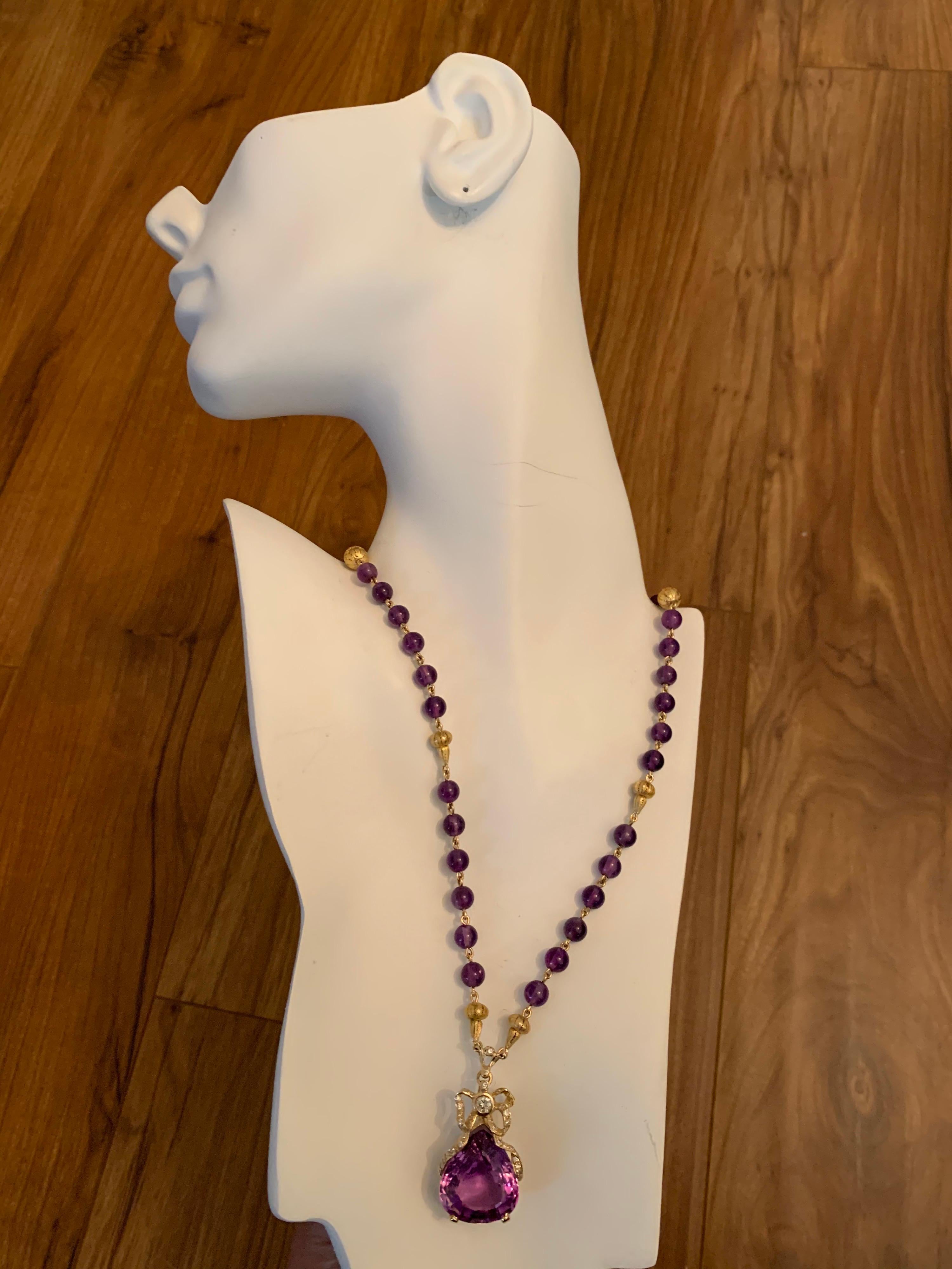Retro 14k Yellow Gold 35 Carat Natural Amethyst & Diamond Pendant Necklace Circa 1960.

The piece is set with 36 Natural Round Brilliant Diamonds (G-I, VS-I) approximately 1 carat weight total. The center stone Purple Amethyst measures approximately