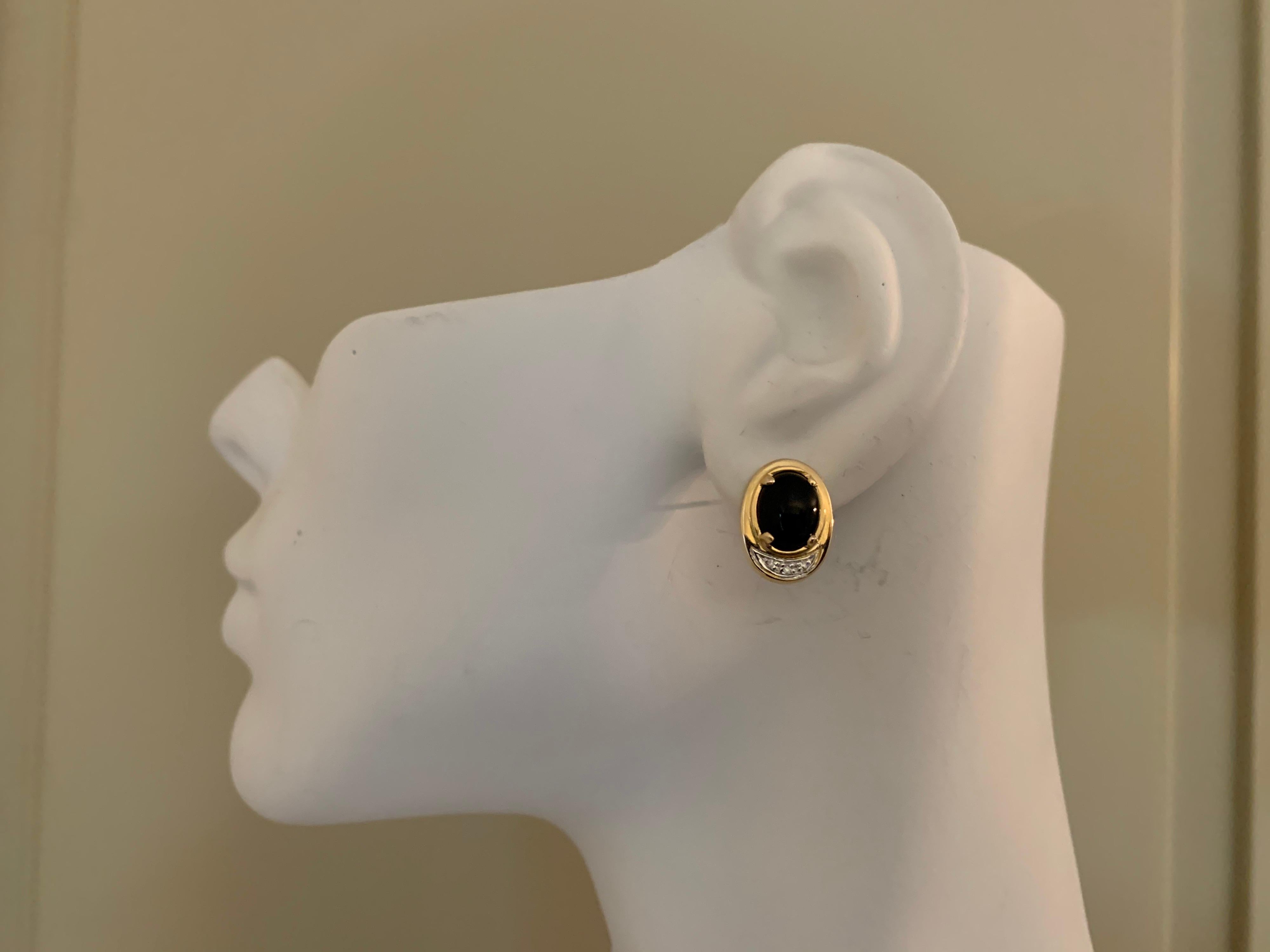 Retro 14k Yellow Gold 4.5 Gram Natural Oval Onyx & Diamond Earrings Circa 1960. 

The piece is set with 6 single cut diamonds weighing approximately .05 carats.