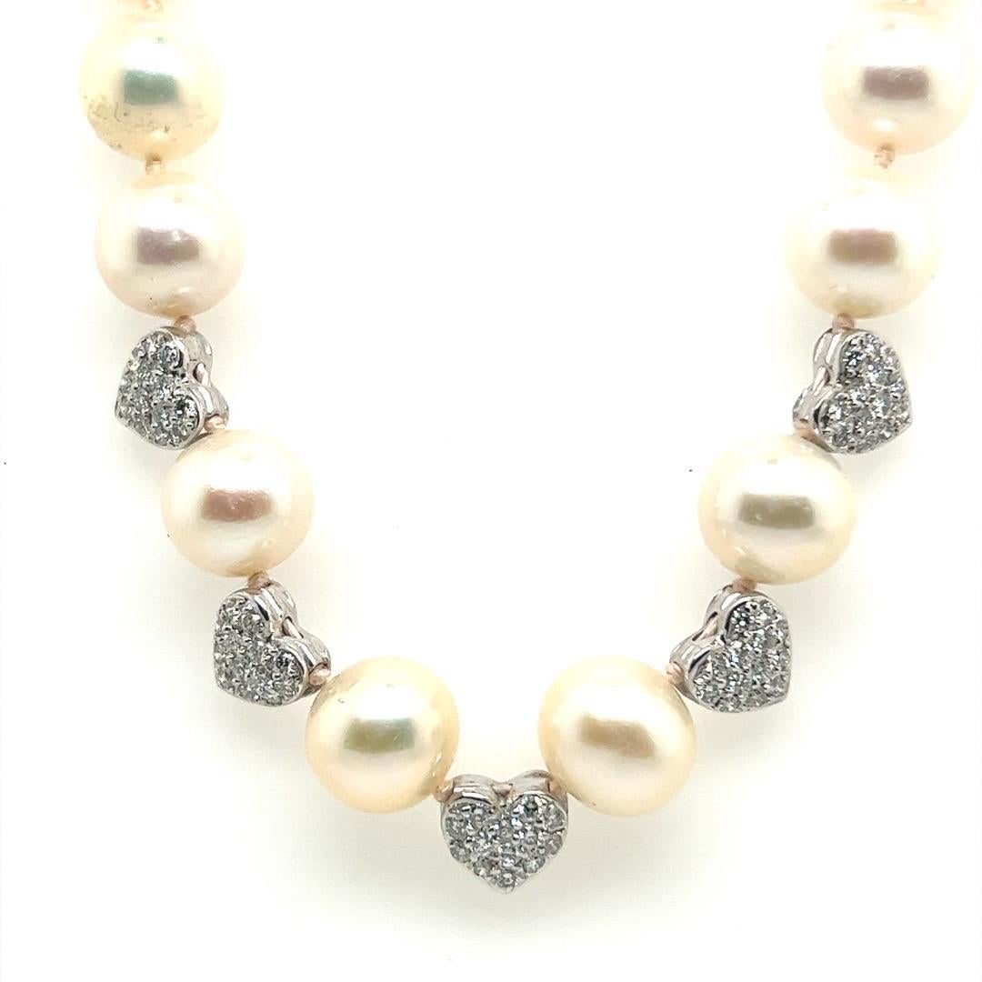 Retro Gold 0.75 Carat Natural Diamond and 9.5-10mm Pearl Necklace Circa 1980.

A Magnificent Cultured South Sea Cultured Pearl Strand set with 38 multi-color pearls measuring approximately 9.5-10mm each. 

The piece also includes five 14k white gold