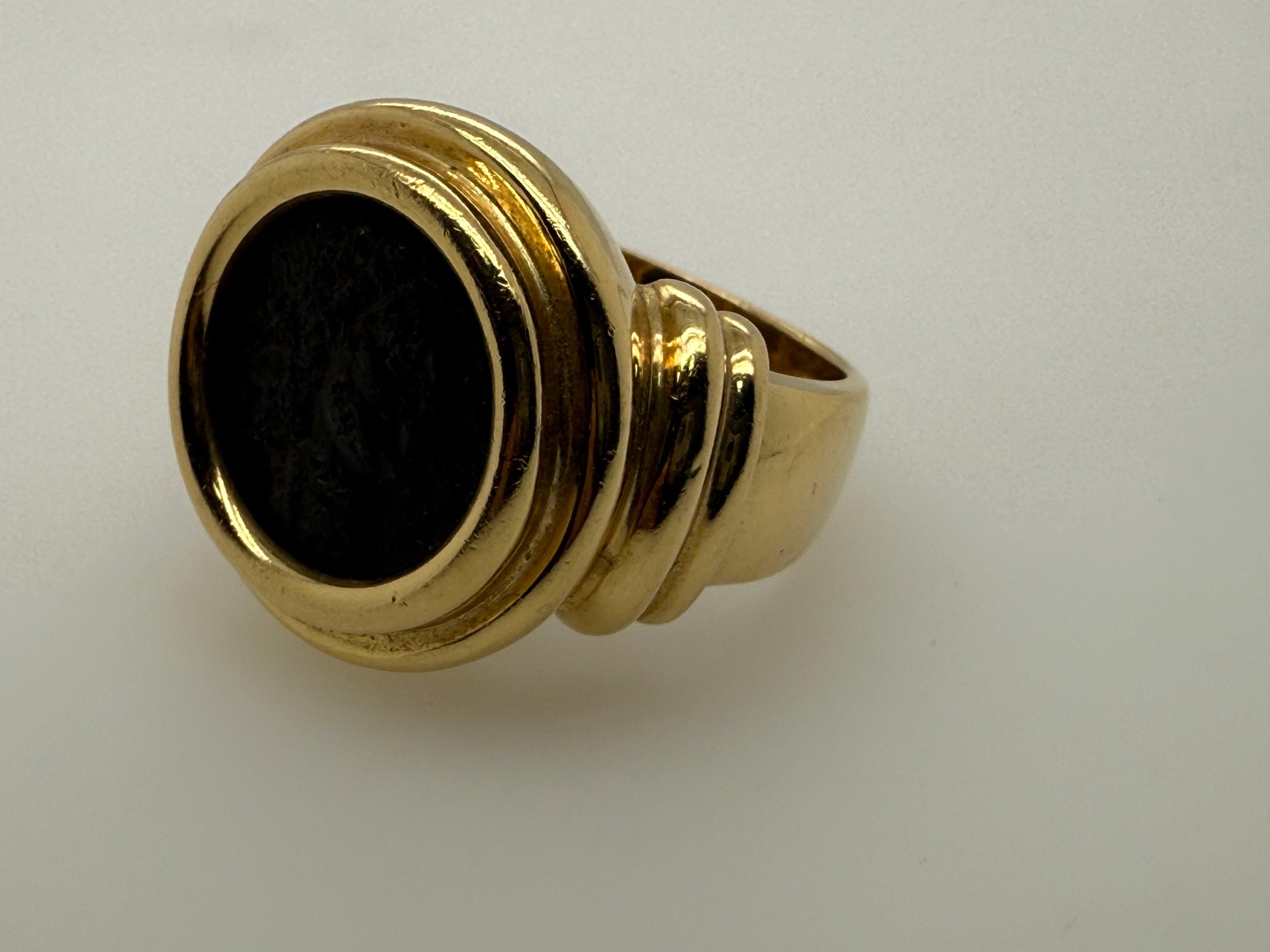 Magnificent 18K yellow gold statement ring, expertly crafted in Italy and set with an authentic ancient Roman coin of Emperor Theodosius. The ring is a size 5 and measures 17 mm across the top, tapering down to 4.3 mm at the base for a comfortable