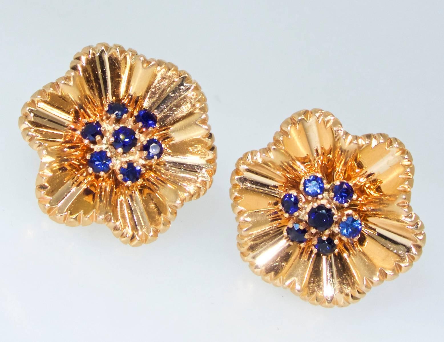 18K yellow gold centering round sapphires, these 14 sapphires weigh approximately .70 pts.  The weight is 16.11 grams, and they are one each in diameter.  These are now non-pierced but can be alter for a pierced ear.  Circa 1950.