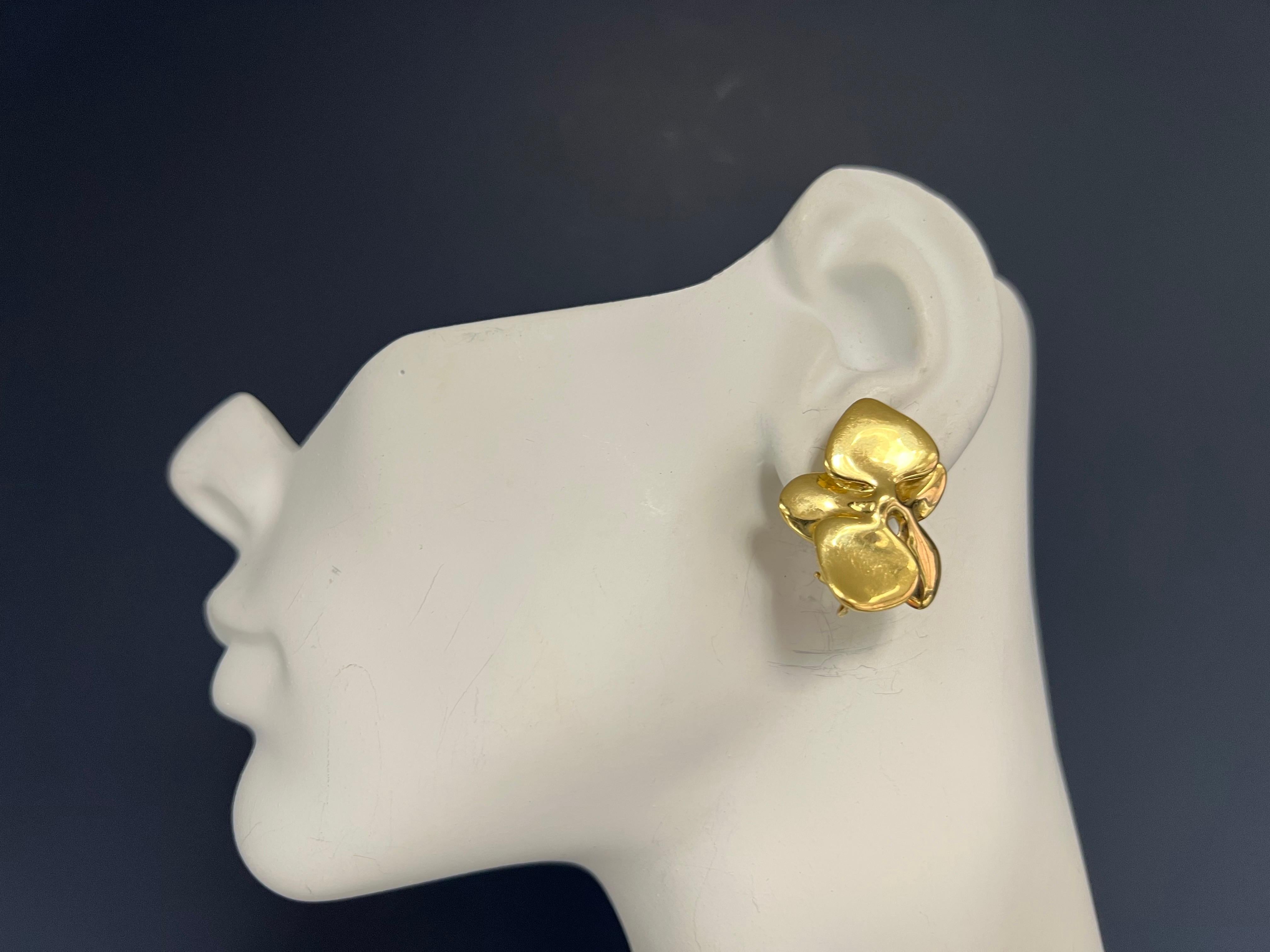 Retro Gold Angela Cummings Floral Orchid Petal Earrings New York Circa 1984.
The earrings weigh 19.6 grams. Each earring contains a gold wire/stem to give the wearer an option of sliding on an attachment that would dangle. 
