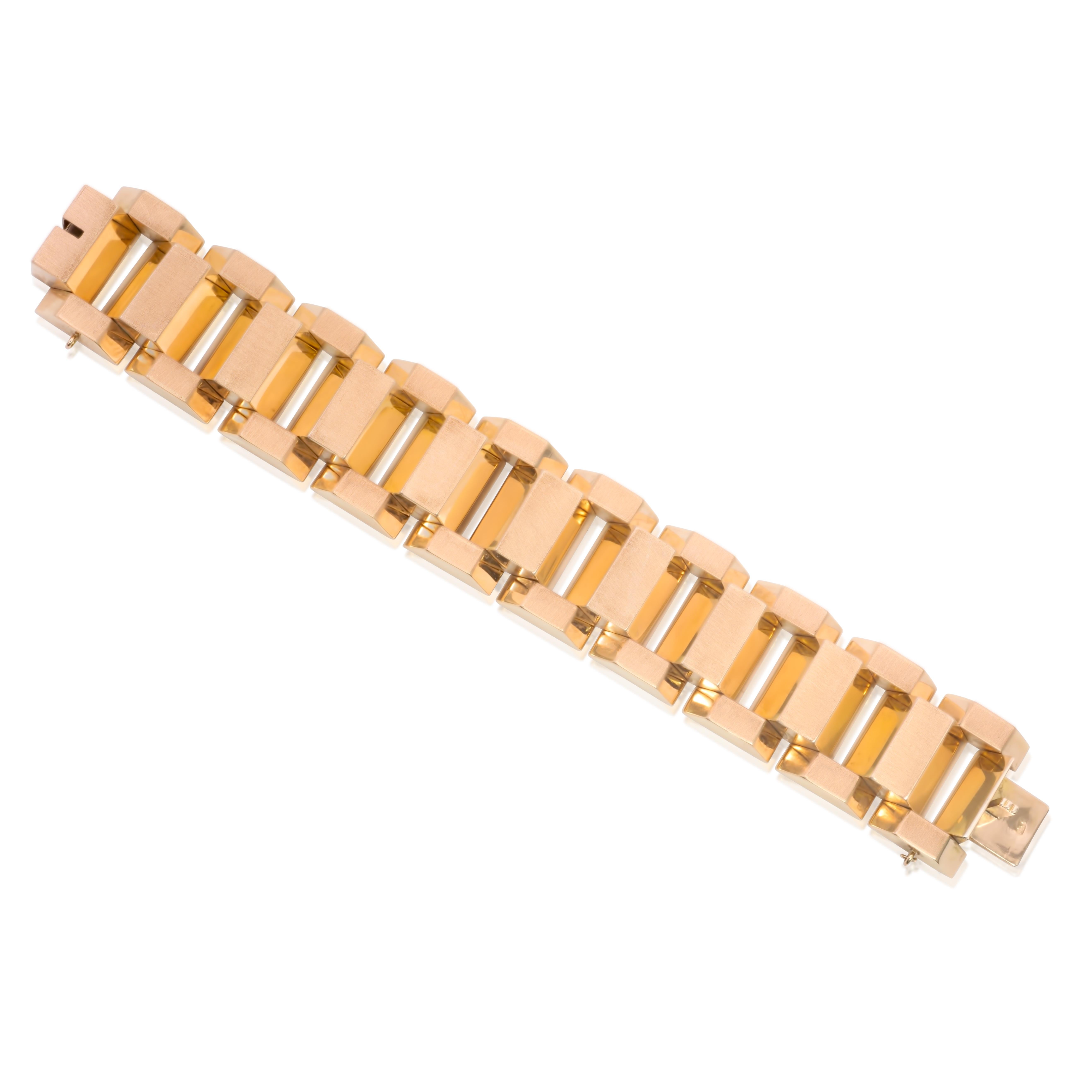 A rare find, retro gold bar fashion bracelet with uniquely shaped links made of 18K rose gold. This tank bracelet weighs 139.00 grams, 7.75 inches long, 1.15 inches wide, and 9.5 mm tall.

