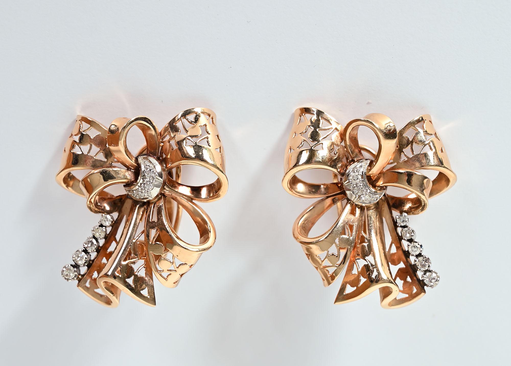 Graceful Retro Bow Earrings of 14 karat gold with diamonds. The bow loops have a lovely openwork design. The earrings have 16 single cut diamonds with a total weight of approximately .51 carats. They are G color; SI 2 clarity.
The earrings have clip