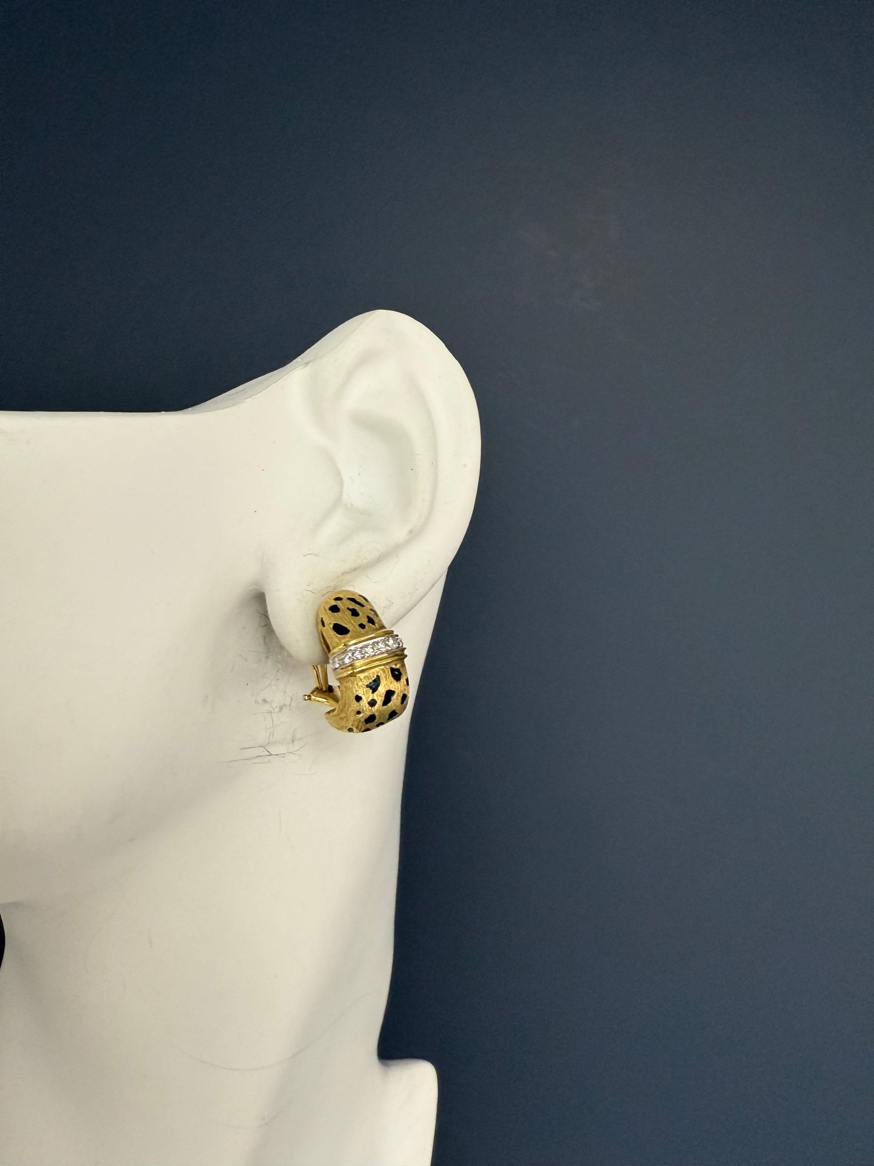 A striking pair of retro 18K gold cheetah earrings, hallmarked with what appears to be the Scully & Scully mark. These substantial earrings are set with 18 natural colorless round brilliant diamonds, offering a bright and timeless appeal. Weighing a