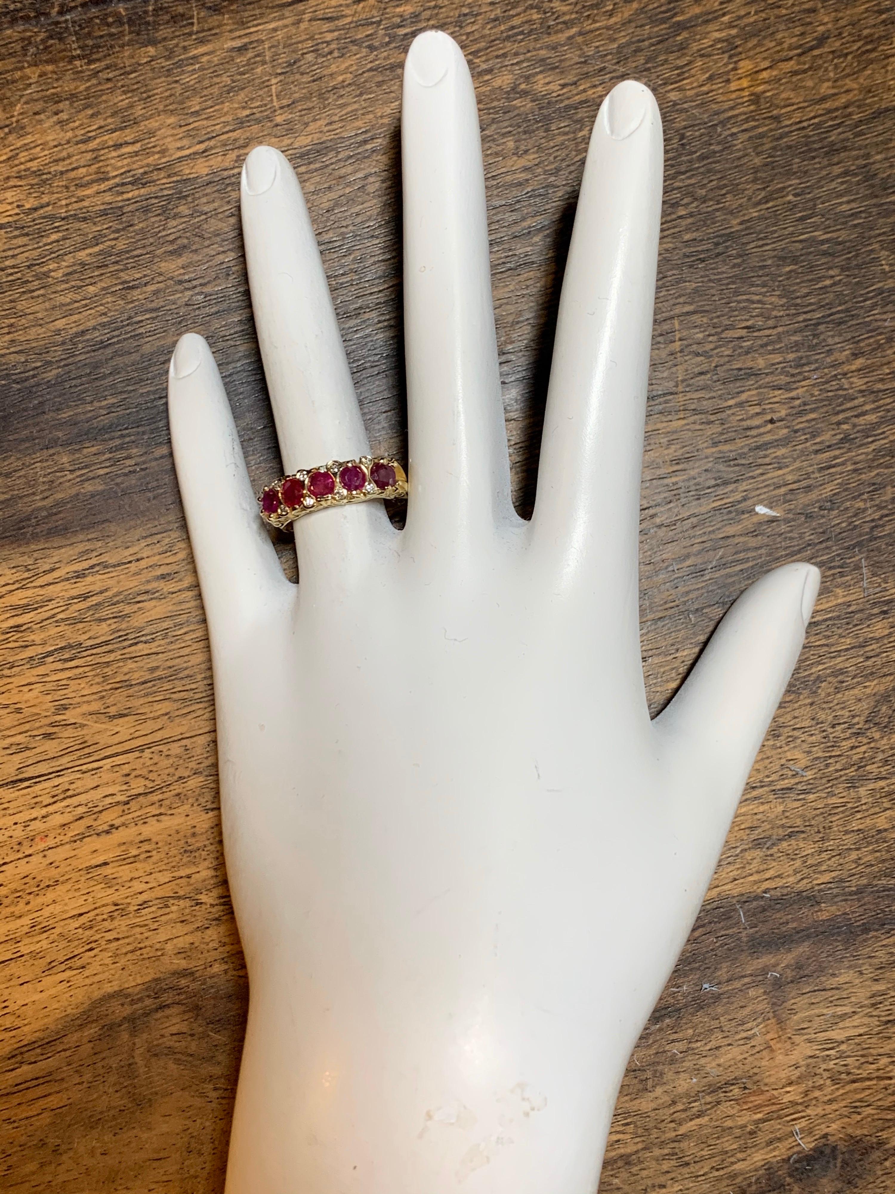 Retro 14k Yellow Gold Cocktail Ring set with five Round Brilliant Natural Rubies (approx 1 carat) & 8 Natural Diamonds (approx .10 Carat) F-G in color and VS-SI in clarity.

Circa 1960.

Ring weight is 3.2 grams, ring size is 6.25.

Condition is
