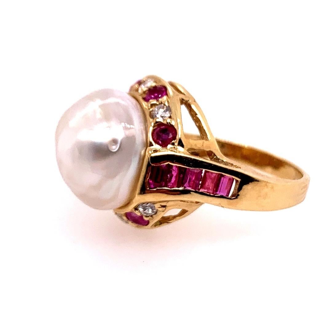 Retro 14k Yellow Gold Cocktail Ring, 1.40 Carat Natural Ruby Diamond & 12.5mm Pearl.

The ring is set with 6 natural diamonds, approximately H color, VS clarity, and 0.25 carats. The 17 natural rubies weigh approximately 1.15 carats. 

The ring