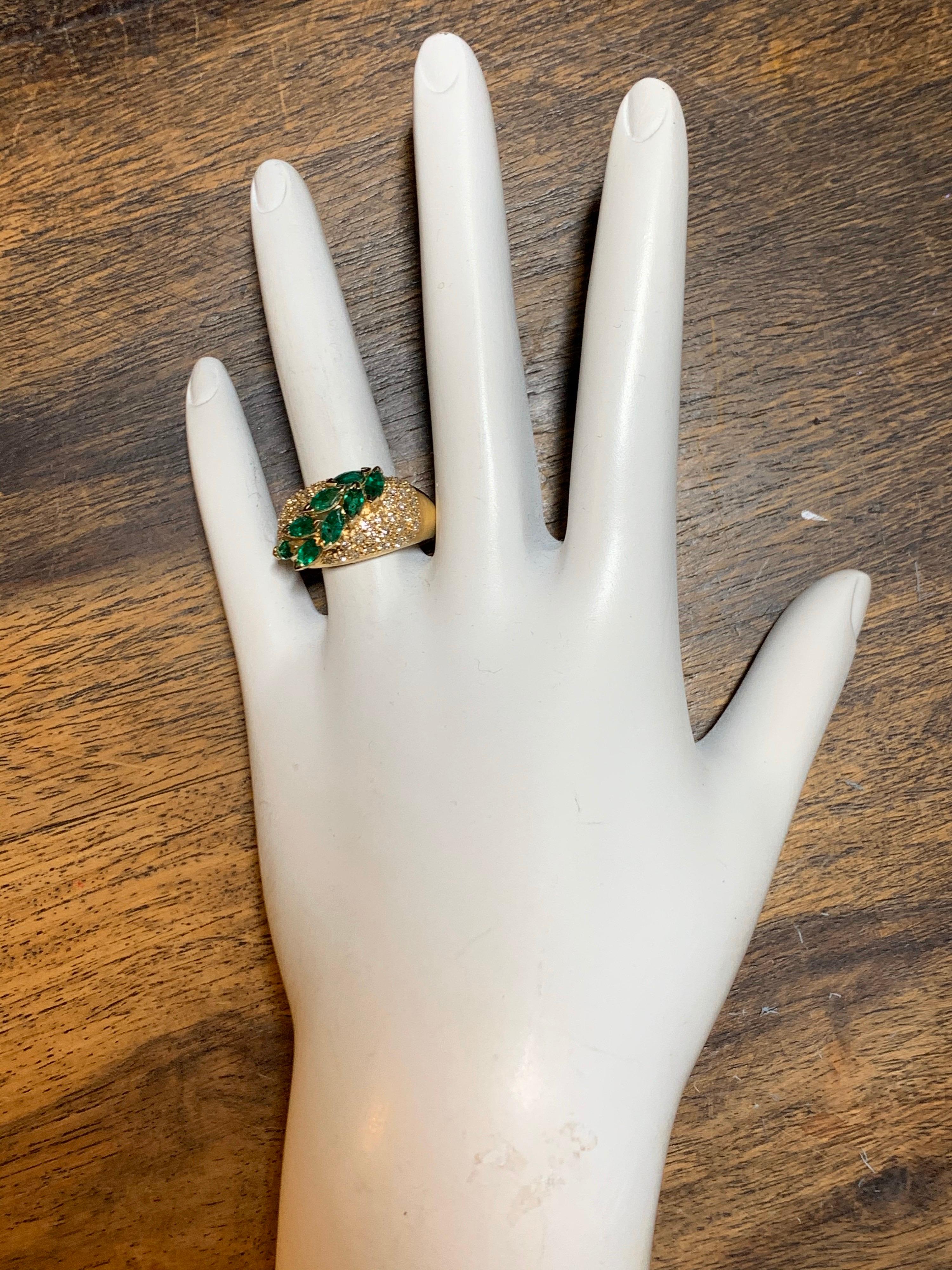 Retro 14k Yellow Gold 1.80 Carat Cocktail Ring set with 8 Natural Marquise (5.25x2.5mm) Shaped Emeralds weighing approximately 1.35 carats & 48 Natural Round Brilliant Diamonds weighing approximately 0.45 carats. Circa 1960. 

Ring size is 6.25,