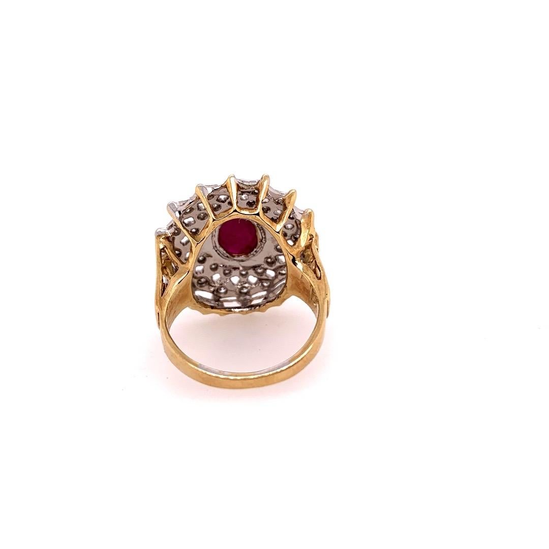 Retro 14k Yellow & White Gold Cocktail Ring set with 2.40 Carats Natural Cabochon Ruby & Diamonds.

The cabochon natural ruby weighs approximately 2 carats measuring 8.6x5.5x3.3 and the 32 natural diamonds weigh approximately 0.40 carats, G-H in