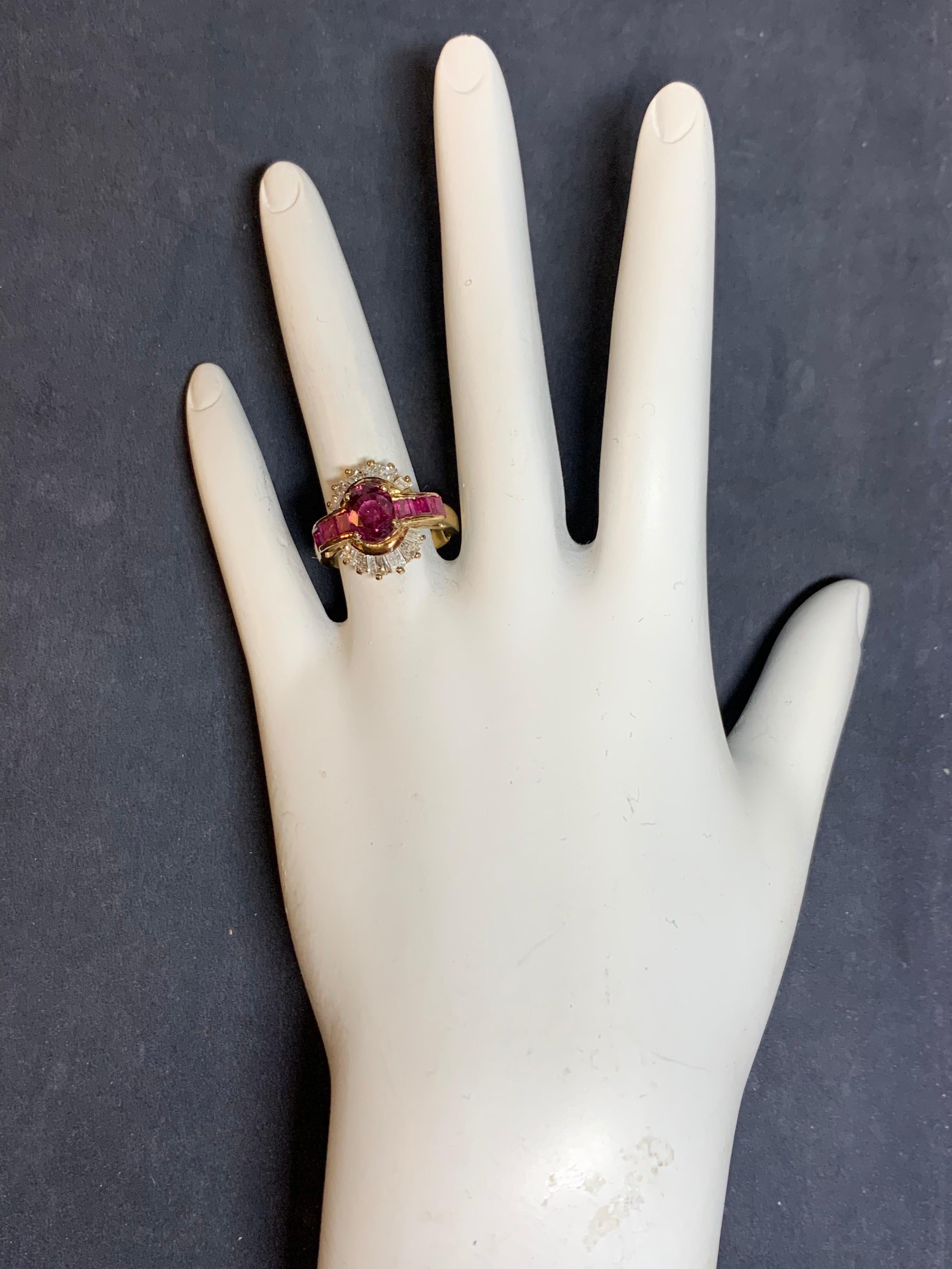 Retro 14k Yellow Gold Cocktail Ring, approximately 3.25 Carats of Natural Rubies & Diamonds.

The center oval weighs 1.67 carats and measures 7.8x6x4 and flanked with 6 square emerald cut rubies weighing approximately 0.83 carats. The 12 tapered