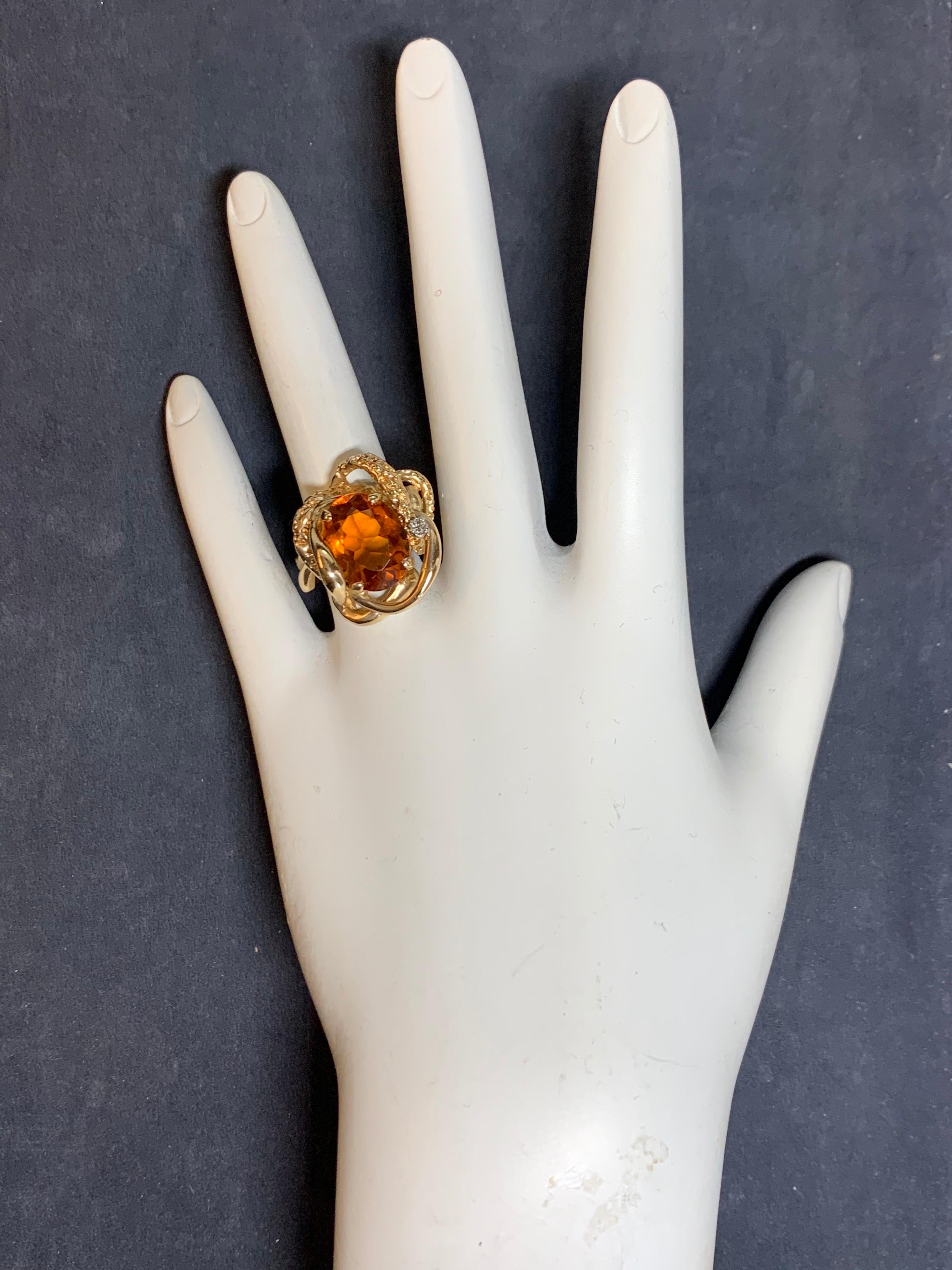 Retro 14k Yellow Gold Cocktail Ring set with approximately 5 Carats of Natural Citrine Quartz & Diamonds.

The center is a natural citrine quartz measuring 10.7x10.2x6.4mm and weighs approximately 5 carats. The ring weighs 11 grams and is a size 6.