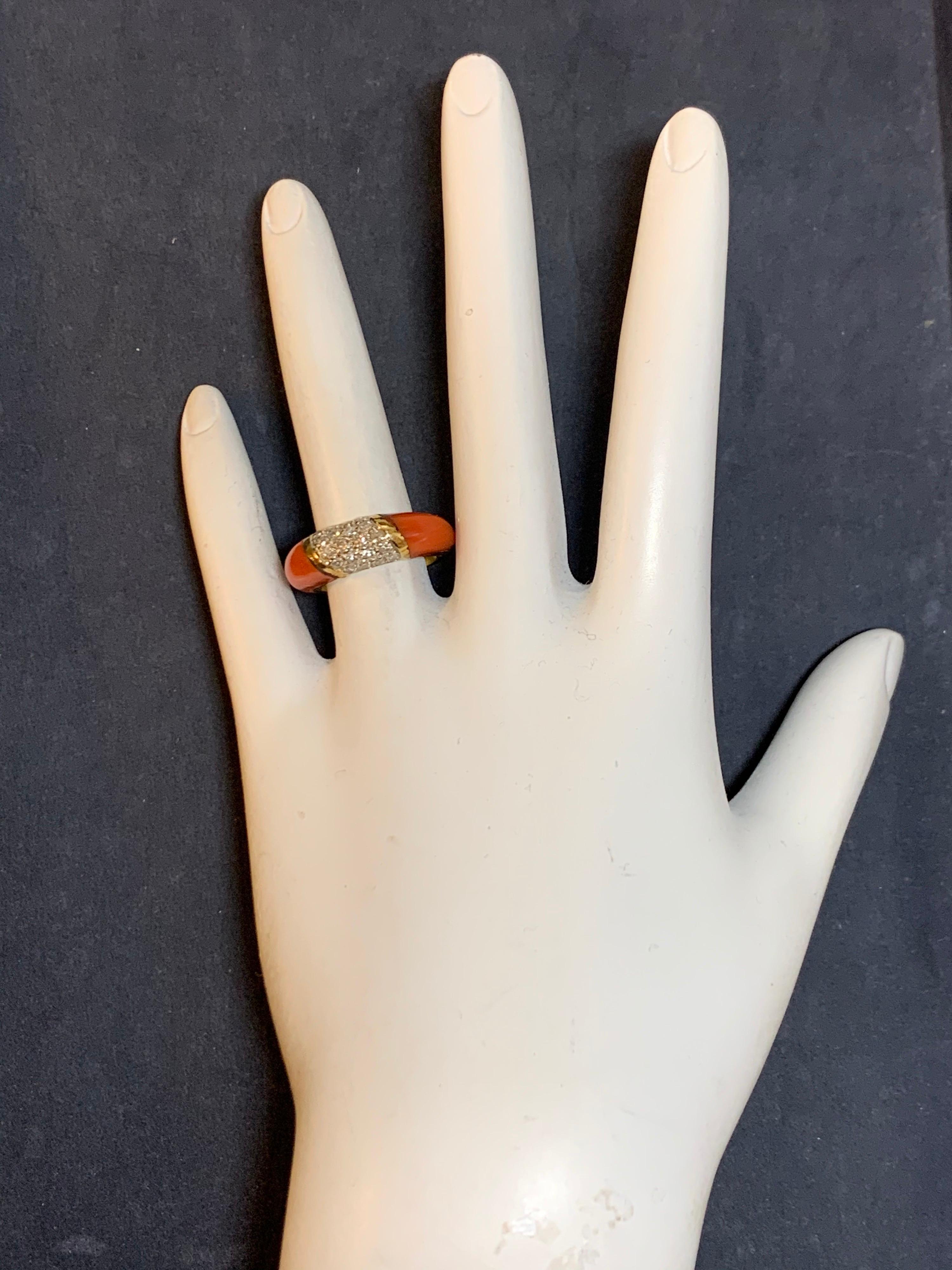 Retro 18k Yellow Gold Ring set with Natural Coral & 20 Natural Single Cut Diamonds, approximately 0.55 carats (G VS).

Ring is a size 5.25, weighs 5.5 grams, width tapers from the top 6.3mm to 2.6mm.

Circa 1950. 