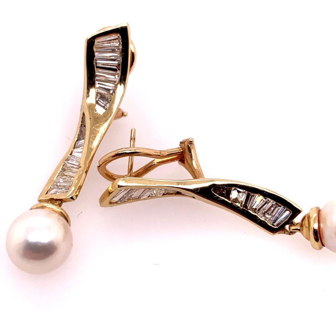 Retro 14k Yellow Gold Earrings approximately 1.50 Carat Natural Tapered Baguette Diamond & Pearl Circa 1970. 

The earrings are set with 28 Tapered Baguettes (H-J, SI Appx) and the total weight of the earrings are 8.4 grams.