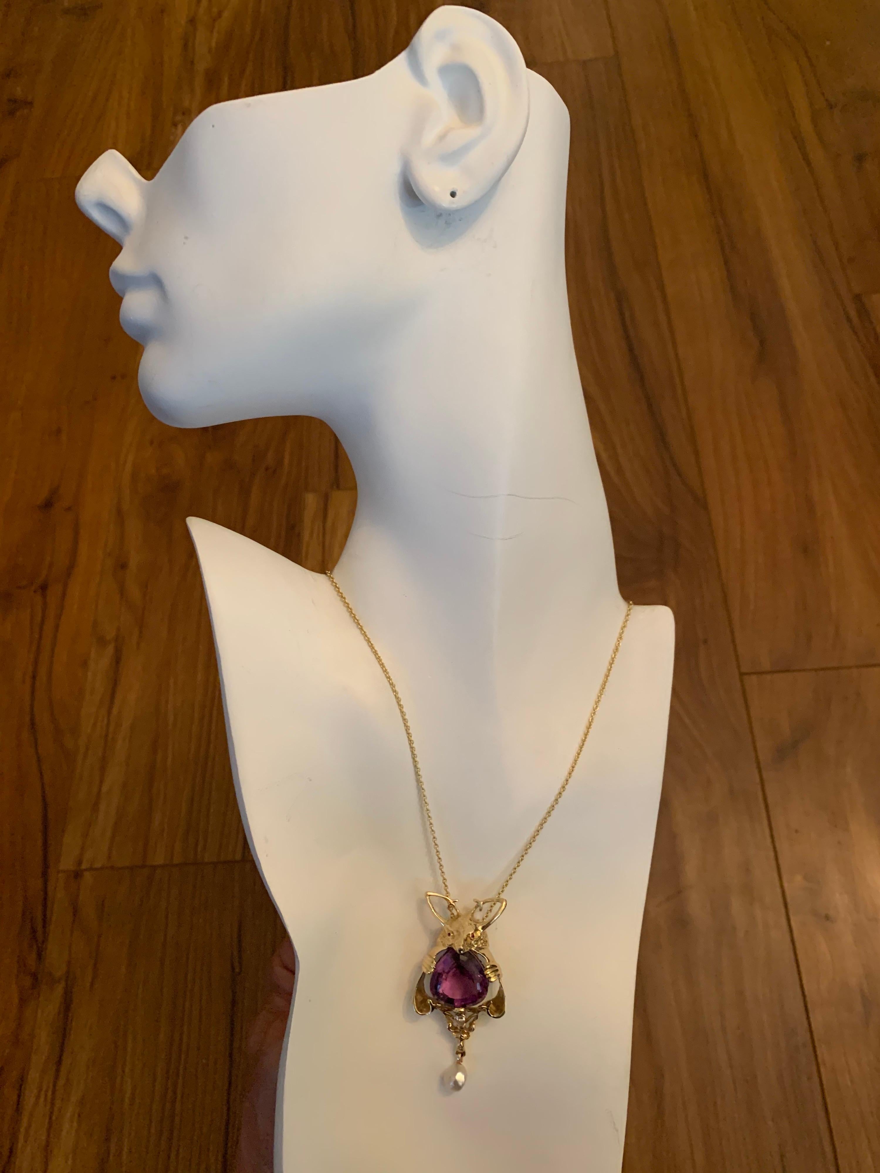 Retro 14k Yellow Gold Kangaroo Pendant set with Natural 0.12 carat pear shaped diamond (4x3.5mm) & 25 carat Amethyst (20x18x12.2mm). Carat weights are approximate.

The total weight of the piece is 22.2 grams. Chain not included.

Condition is