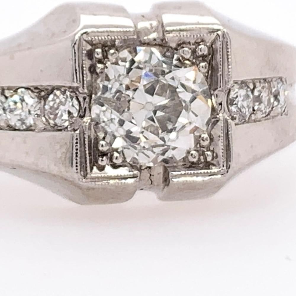 A magnificent 18k white gold men's ring. The ring is a size 10.5 and weighs 11.82 grams.

The center stone is an approximate 1 carat natural Old European diamond measuring 6.1x4.5mm, approximately G in color and SI1 in clarity. 

The ring contains