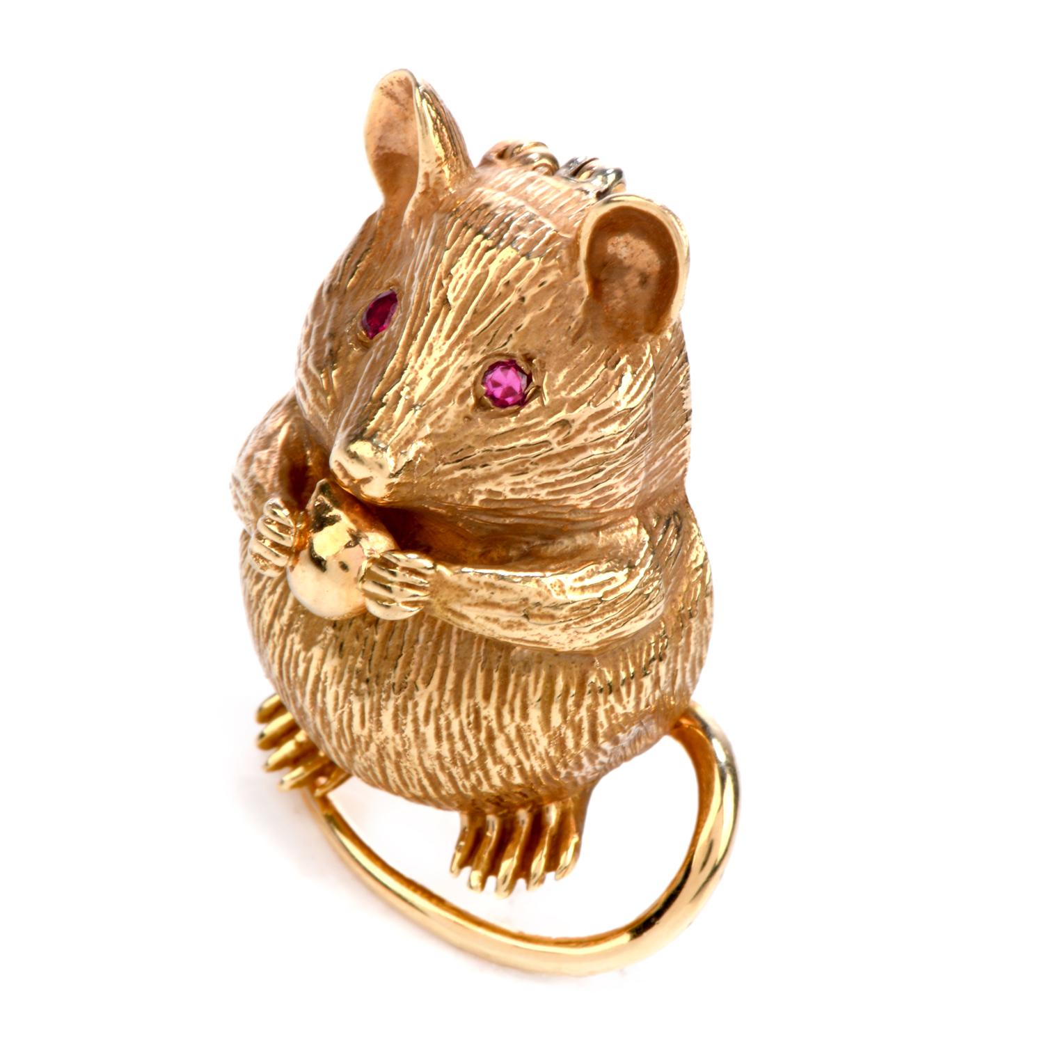 This charming Vintage Mouse Inspired Finely Textured Brooch & Pendant,

Crafted in 14K Yellow Gold,

It Is adorned in the Eyes by 2 genuine round cut Rubies, weighing approx. 0.06 carats,

With a Retractable Bale, it can be worn as a Pin or as a