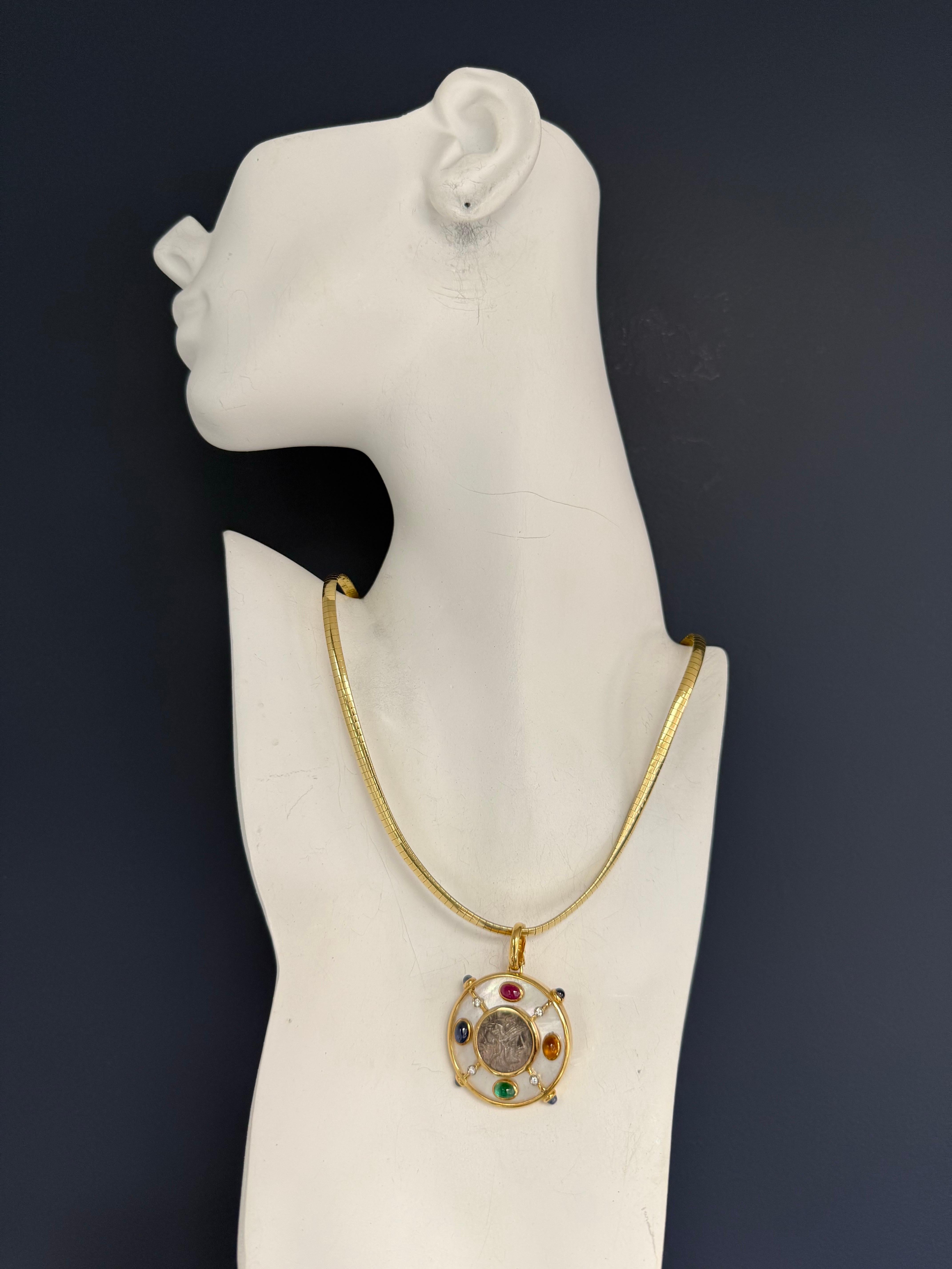 Retro Italian pendant crafted in 18K yellow gold, centering an authentic ancient Roman bronze sestertius coin from the reign of Emperor Antoninus Pius (138–161 AD). The coin is framed in a bold gold bezel and further enhanced with an array of fine