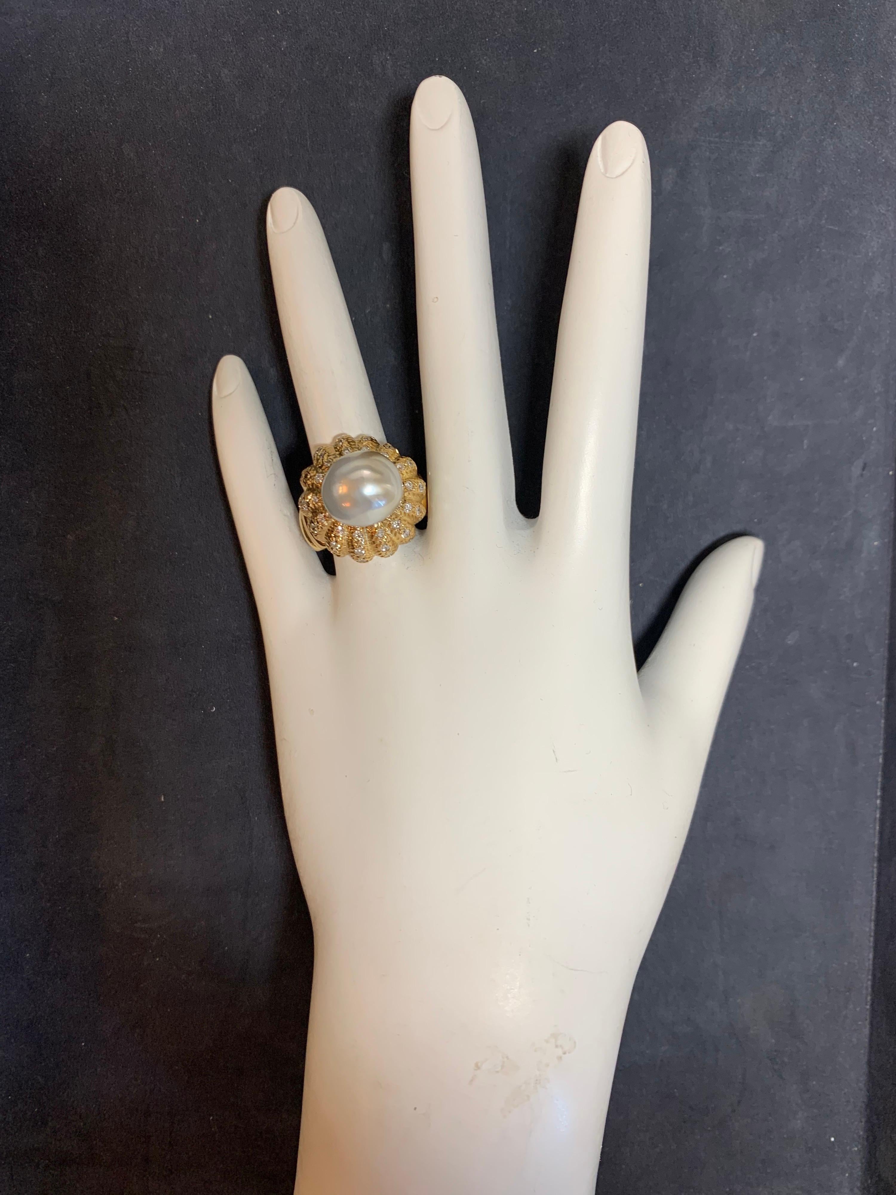 Retro 14k Yellow Gold Cocktail ring set with Natural 11mm Pearl & 0.81 Carat Natural Colorless Round Diamonds, approximately F in color and VS-SI in clarity. 

Condition is Pre-owned, weight of ring is 12.6 grams, and is a size 7.

Circa 1950. 